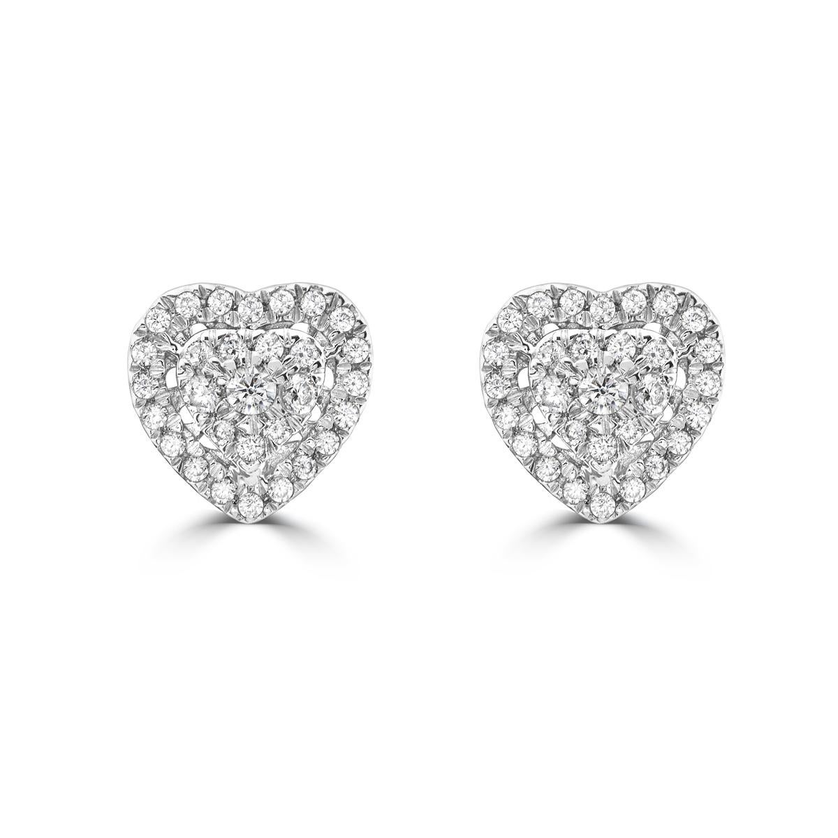 Indulge in the elegance of our Diamond Cluster Heart Stud Earrings. Featuring a stunning heart design, these 14k white gold earrings are perfect for everyday wear. The diamond cluster adds a touch of sparkle, making them the ultimate everyday