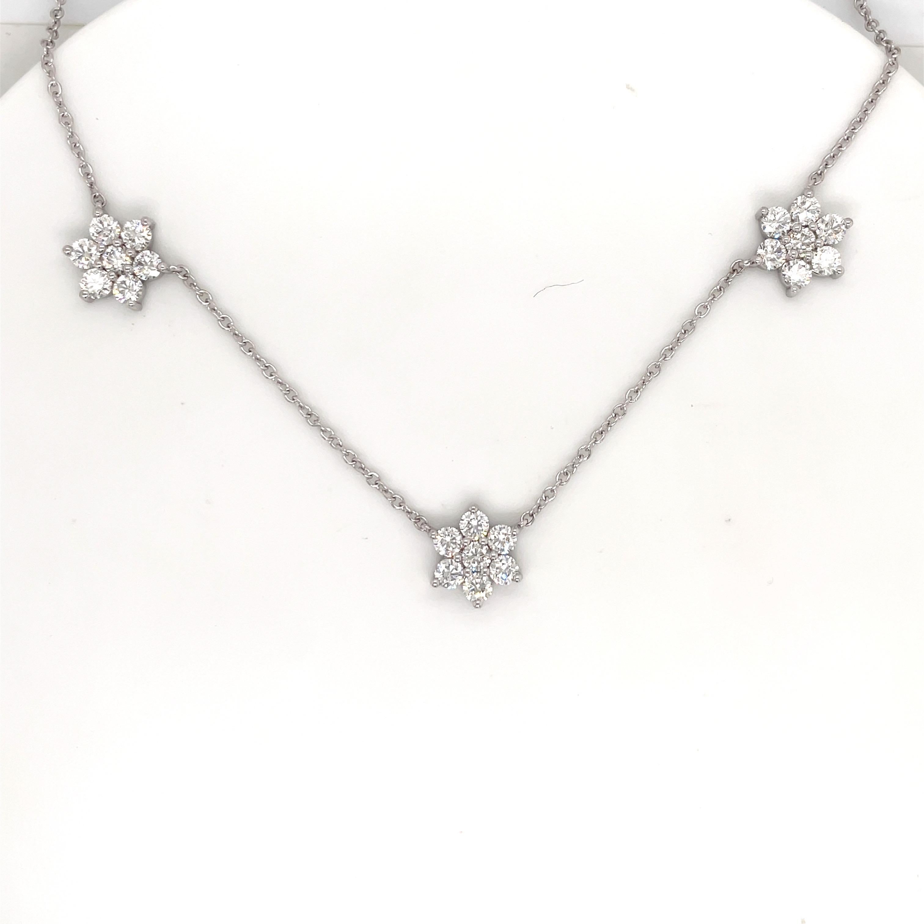 14 Karat white gold necklace featuring three diamond clusters each containing 7 diamonds weighing a total of 3.08 carats.
Average Diamonds: 0.15 pointers
Color G-H
Clarity SI