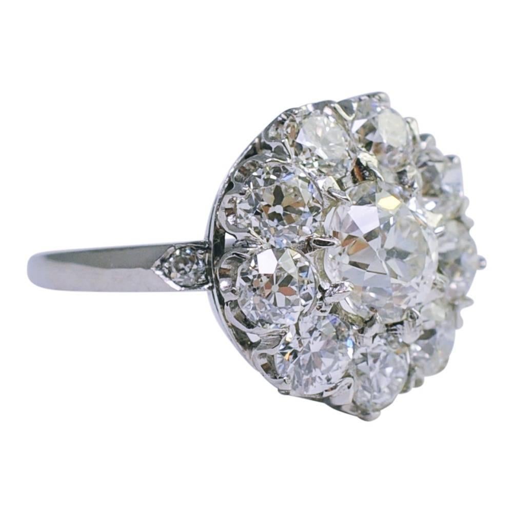 Gorgeous, big juicy diamond cluster ring set in platinum; the central Old European Cut diamond weighs 1.40ct and is surrounded by a further 2.40ct of sparkling Old European Cut diamonds.  Total diamond weight 3.80ct.  All the diamonds are bright