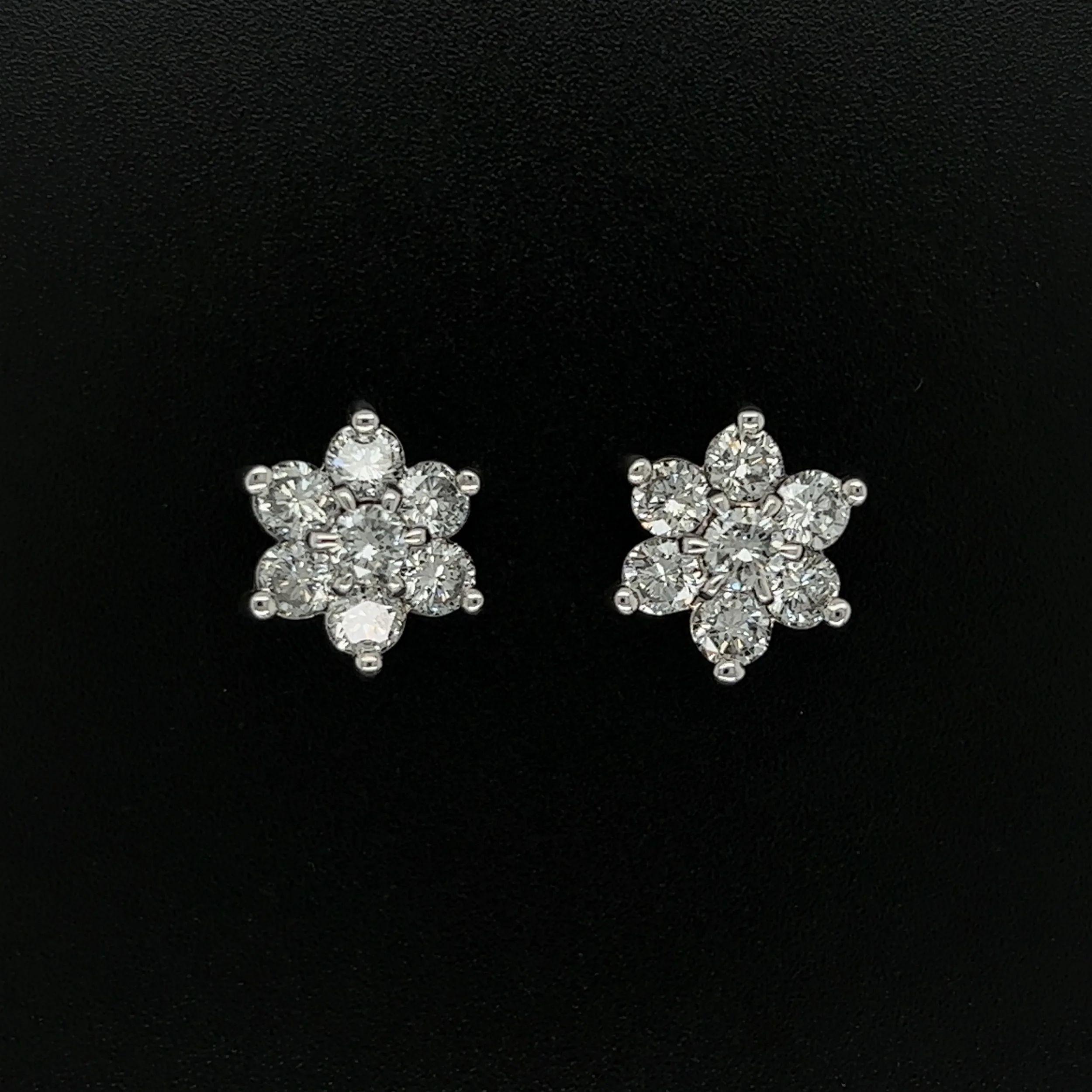 Simply Beautiful! Pair of round Diamond Cluster Gold 12.2mm Stud Earrings. Securely nestled Hand set Diamonds, weighing approx. 2.08tcw, in Platinum four-claw setting. Measuring approx. 0.72” L x 0.43” W x 0.47” H. These earrings are in excellent