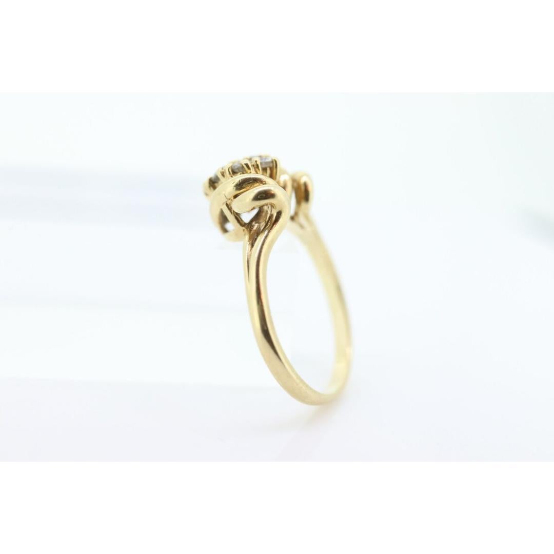 Vintage from the 1980s
Size: 7 US
Materials: Stone
Gemstone: Diamond
Gem color: Colorless
Band color: Gold

Style: Avant garde

Amazing piece. This rind definitely makes a statement. Vintage from about 80s era. Handmade formed shank with cast