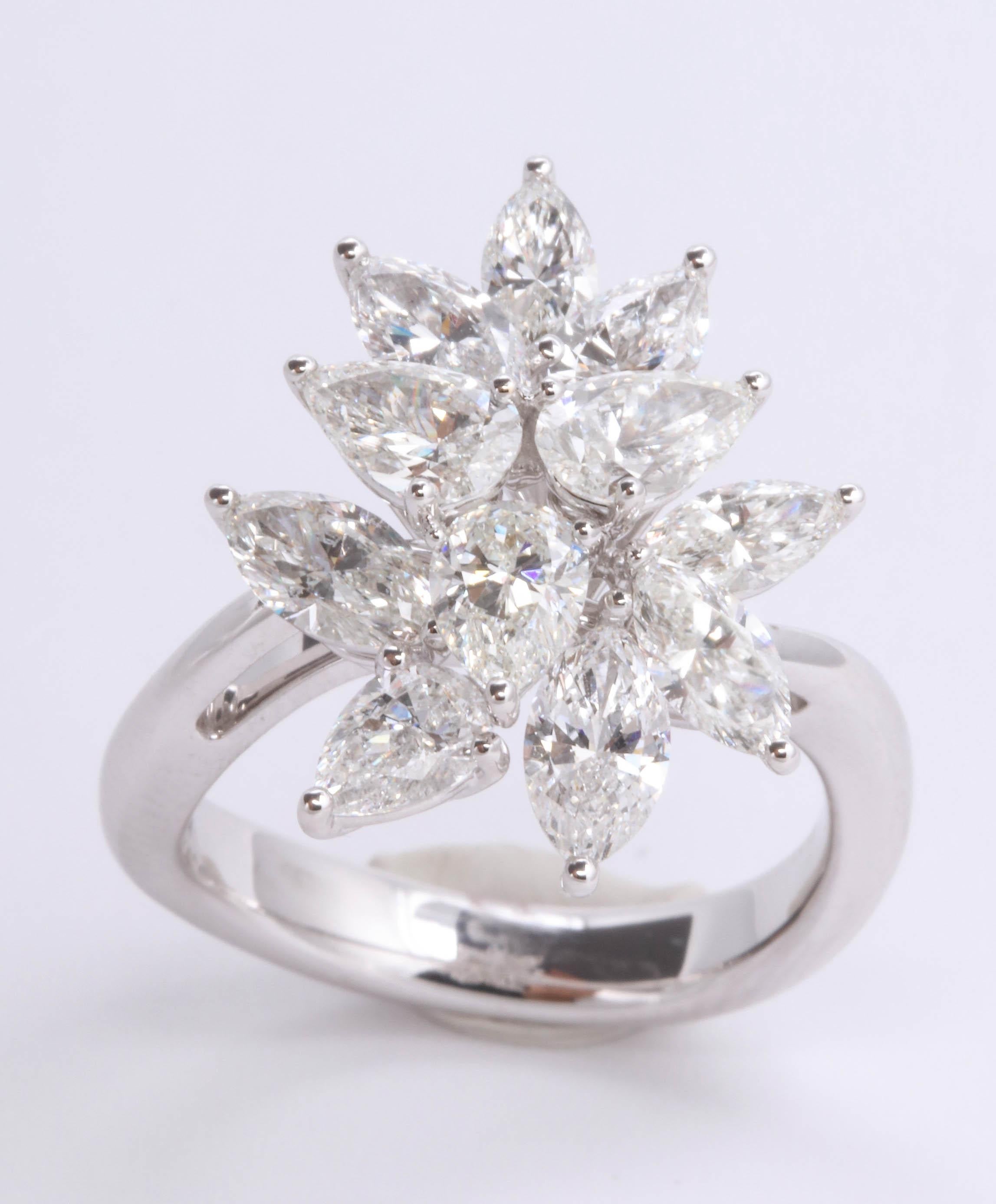 
A stunning ring!

4.01 carats of white pear and marquise shaped diamonds set in 18k white gold. 

Currently a size 7, this ring can be adjusted to any finger size. 

Matching earrings are available in our 1STDibs store.

Designed to compliment