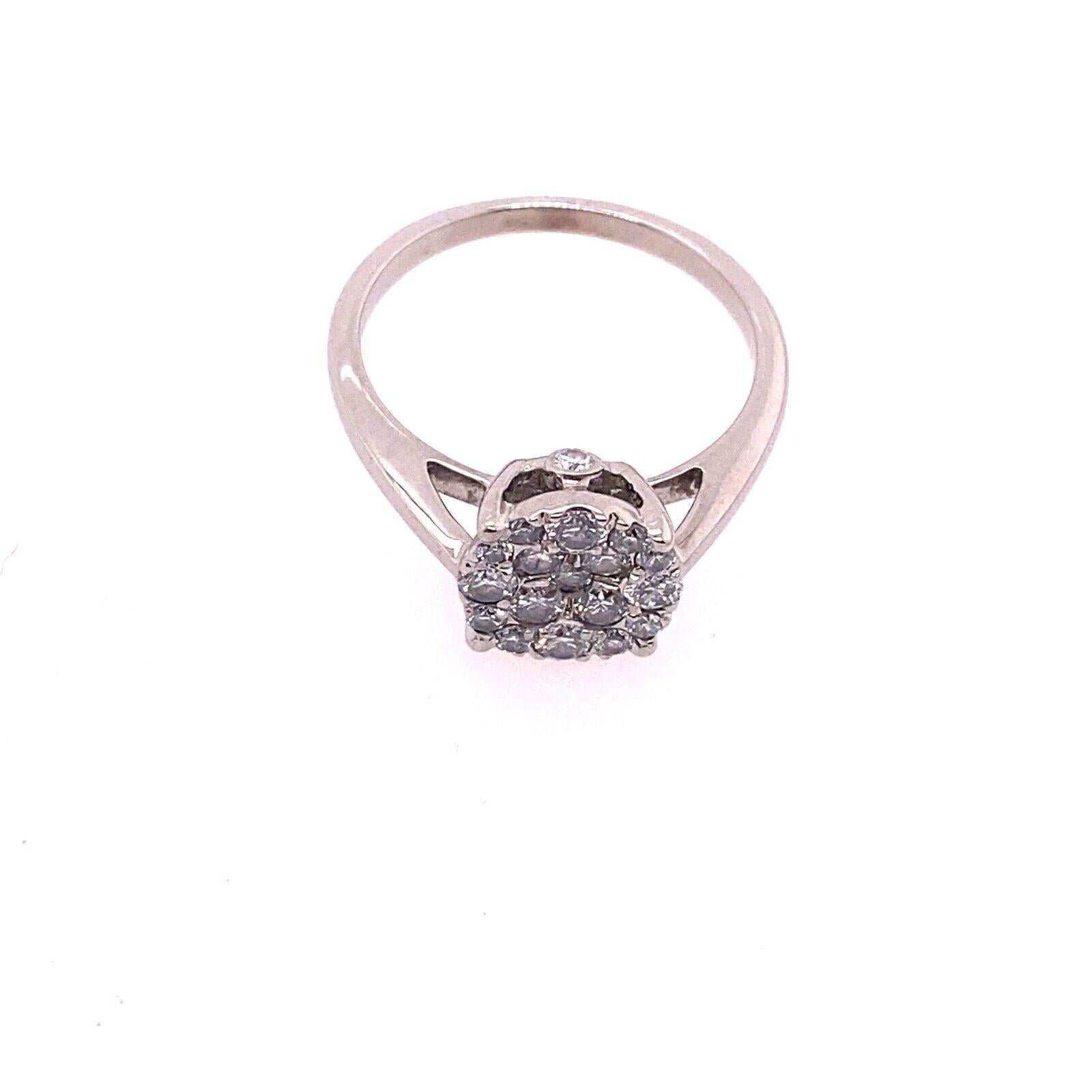 This dazzling cluster ring with 0.35ct of round brilliant cut Diamonds, making it the perfect style for a engagement ring. The ring is made of 18ct White Gold.

Additional Information: 
Total Diamond Weight: 0.35ct
Diamond Colour: G-H
Diamond