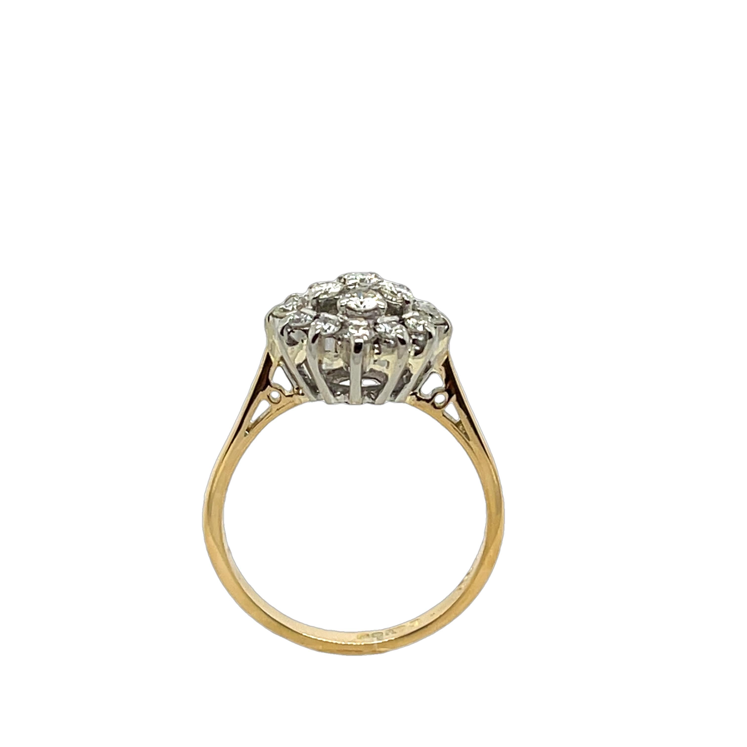 A beautifully crafted diamond cluster ring, 
set in 18ct yellow & white gold, featuring 0.65ct of natural 
diamonds arranged in a cluster setting. 
Total Diamond Weight: 0.65ct
Diamond Colour: H
Diamond Clarity: SI1
Width of Band: 2mm 
Width of