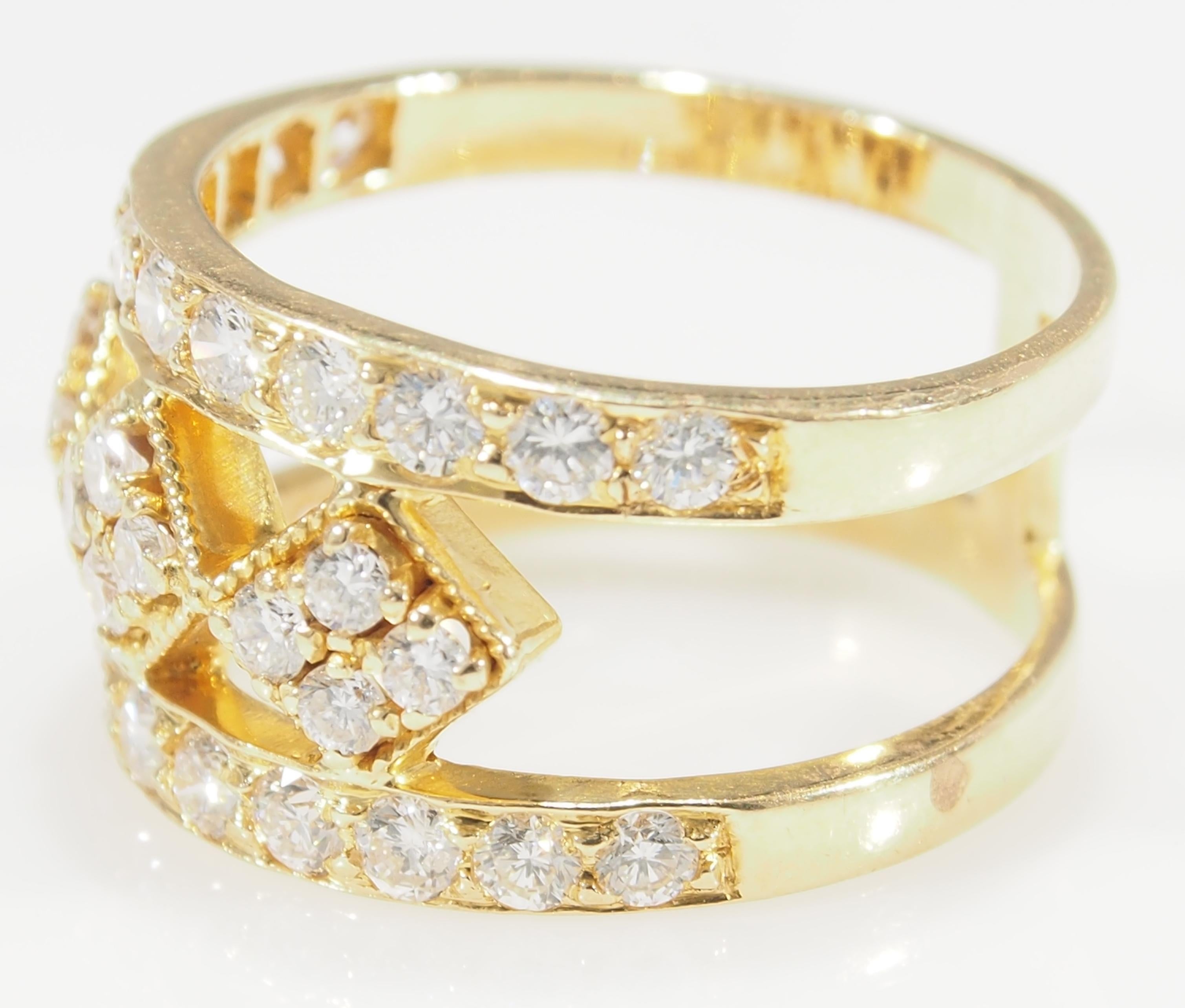 This is a striking 18 Karat Yellow Gold Diamond Band. There are 2 Rows of Diamonds with 3 Geometric Diamond Shapes in the Center of the Band to create a stunning fashionable Ring. With (34) Round Brilliant Cut Diamonds, G-H in Color, VS-SI in Color