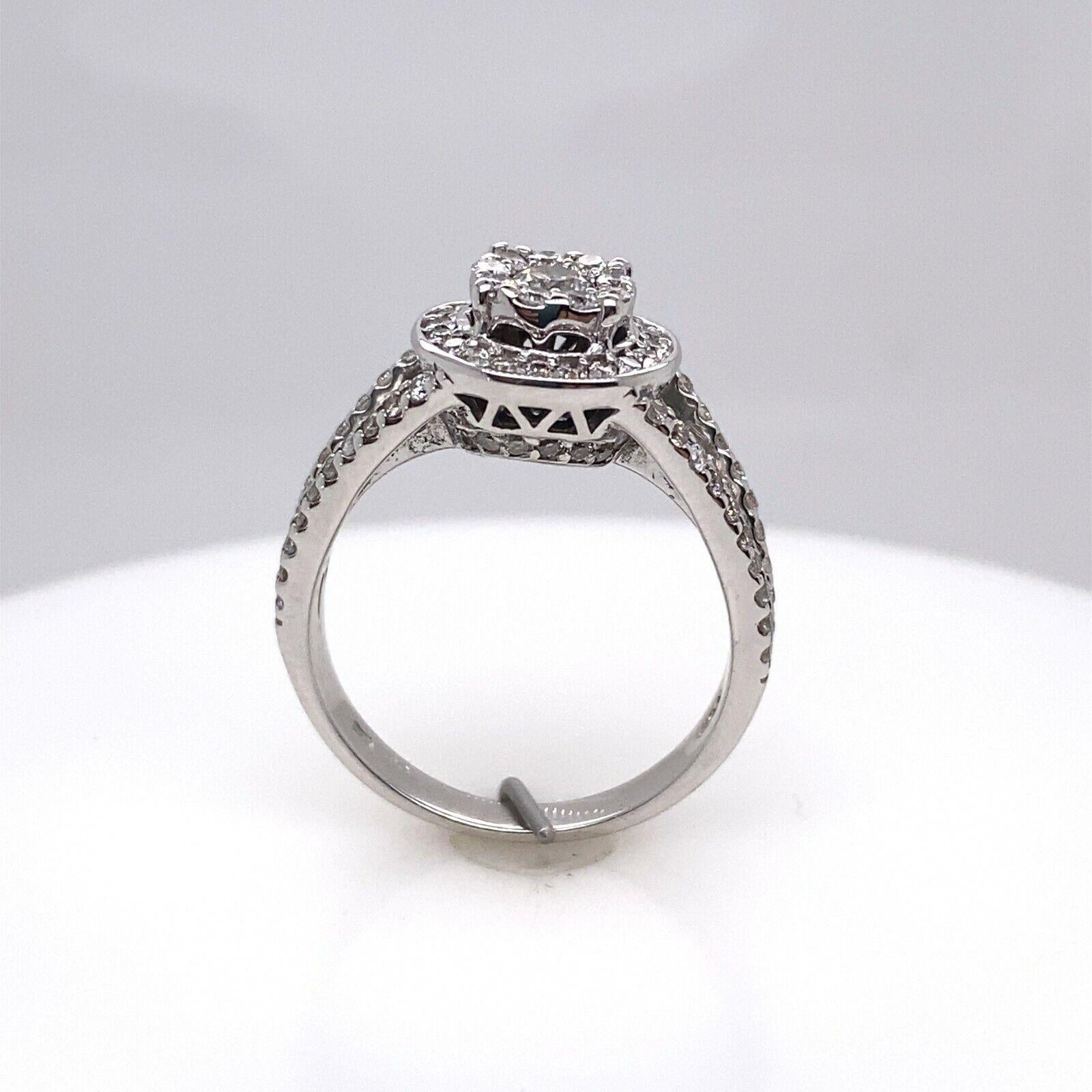 18ct White Gold Diamond Cluster Ring, Set With 0.75ct of Round Diamonds

Additional Information:
Total Diamond Weight: 0.75ct
Diamond Colour: G/H
Diamond Clarity: SI
Total Weight: 4.8g
Ring Size: K1/2
Width of Band: 3mm
Width of Head: 10mm
Length of