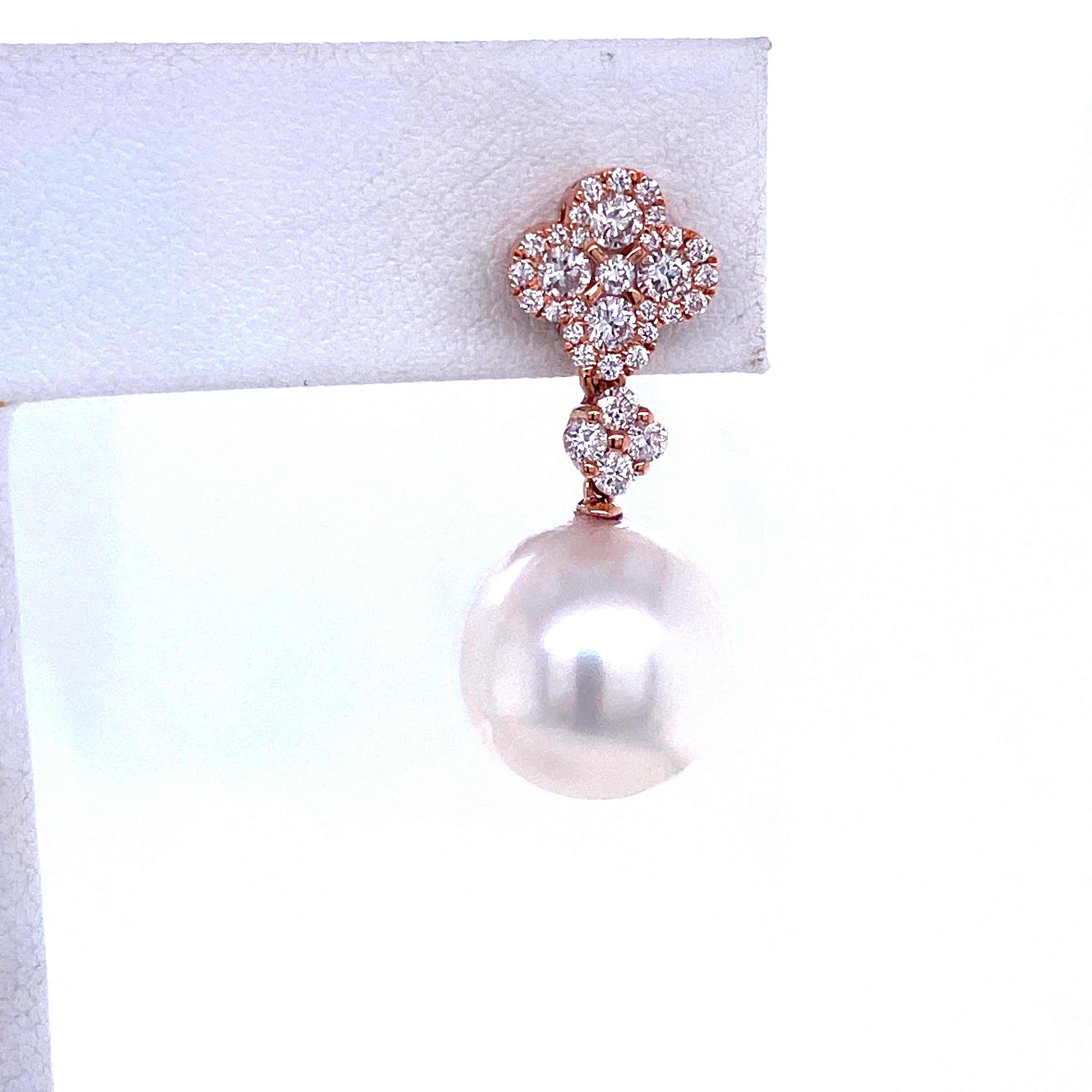18K Rose gold drop earrings featuring two South Sea Pearls measuring 11-12 mm with 8 round brilliants on top weighing 0.37 carats flanked with 58 smaller diamonds weighing 0.40 carats.
Color G-H
Clarity SI

Pearl can be changed to a Pink, Gold or