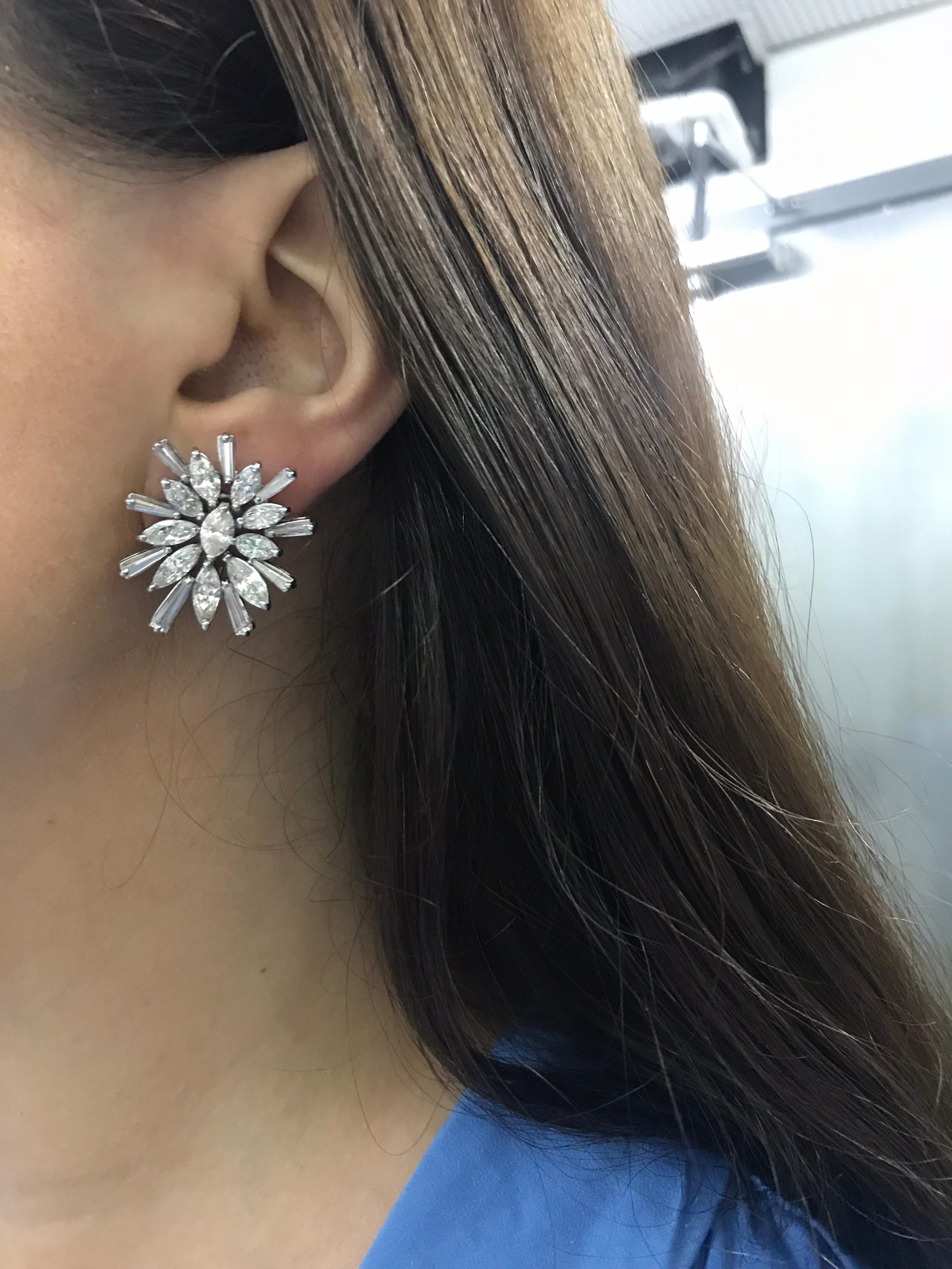 18K White gold earrings featuring a cluster of marquise and tapered baguette diamonds weighing approxiately 9.20 carats.

A gorgeous & impressive pair of earrings. Can be converted into a Day & Night with a pearl or gemstone. Email for more details. 