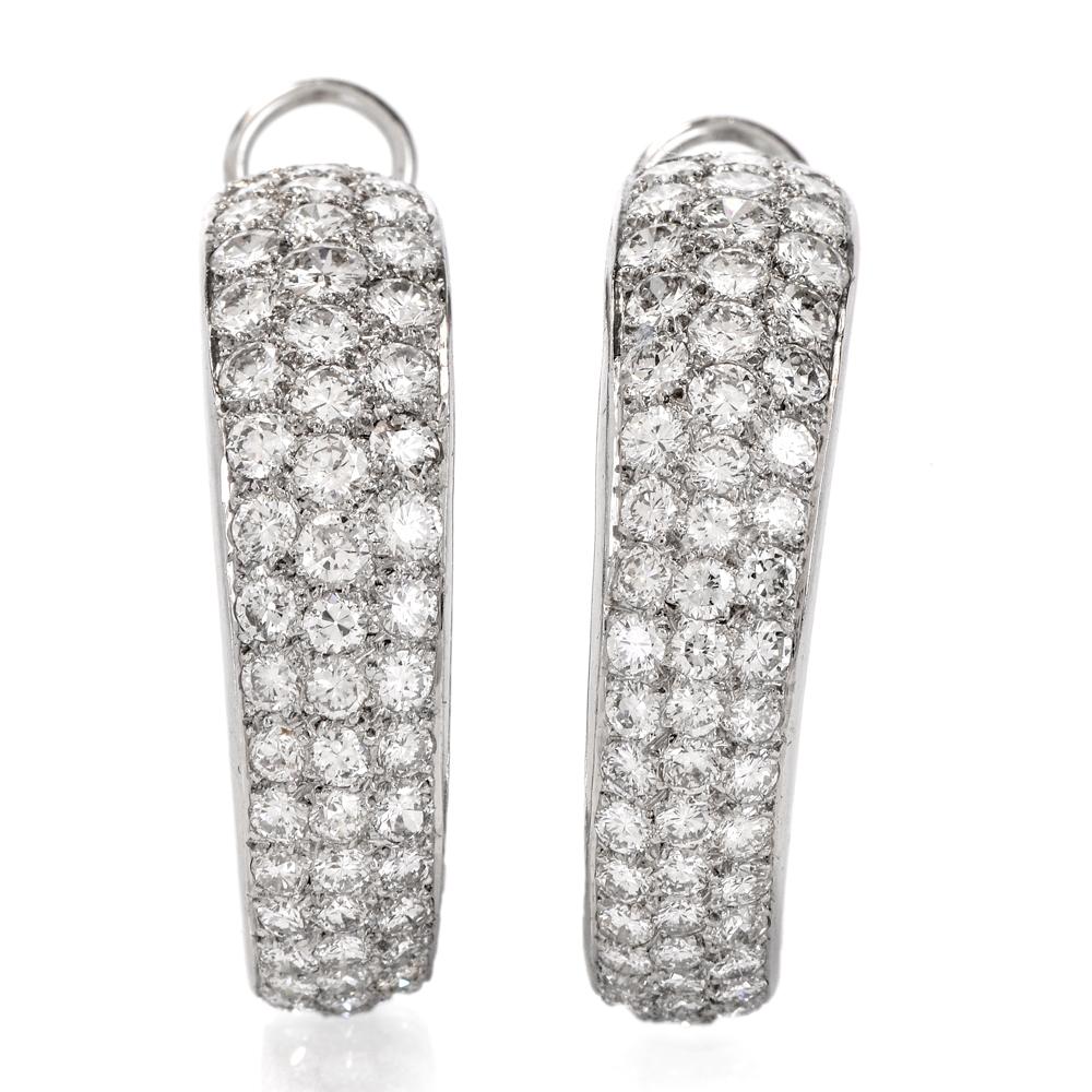 These shimmering diamond cluster hoop earrings are crafted in 18k white gold. Displaying a cluster of approximately 216 round-cut diamonds approx. 13.60 carats, graded G-H color, and VS1-VS2 clarity. Weighing 20.5 grams, measuring 32mmx31mm in