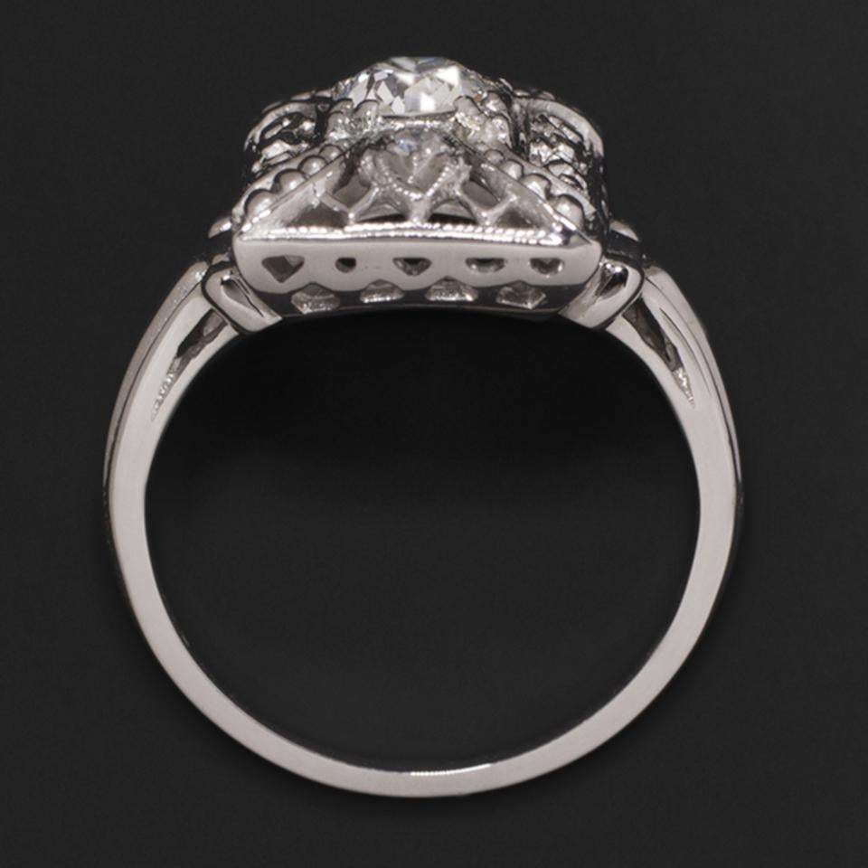 Cocktail ring encrusted with stunning diamonds, high quality and elegantly handcrafted with a geometric structure. The ring is made with a very high quality European cut diamond certified by the GIA (largest certifying body in the world) as F for
