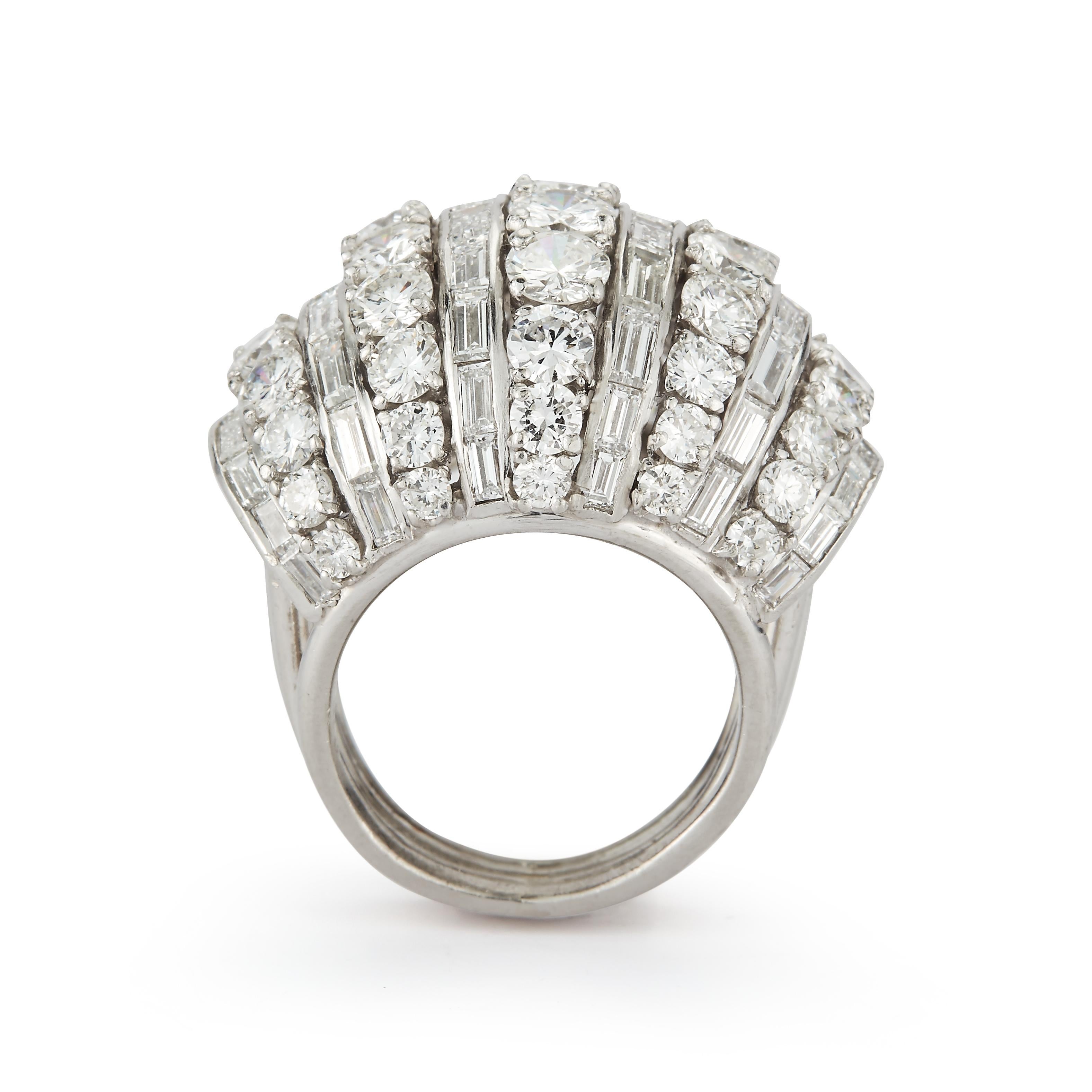 Diamond Cocktail Ring, 11 rows of round & baguette cut diamonds set in 18k white gold 

Approximately 11 carats of diamonds

Ring Size: 4

Sizable to any size