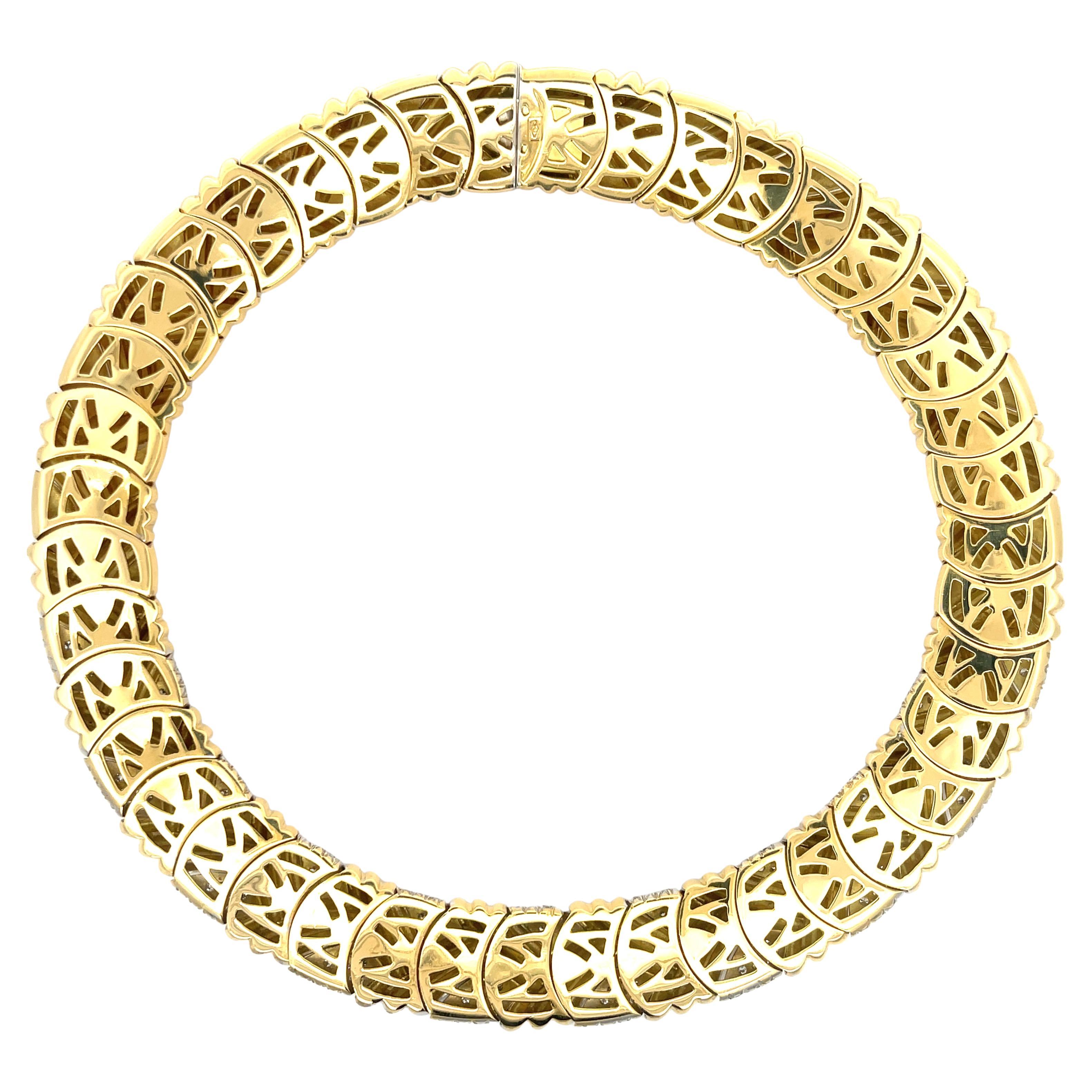 Diamond Collar Necklace in 18K Yellow Gold. The necklace features approximately 6.65ctw of brilliant round diamonds. The necklace is 16 inches long, 18mm wide, and weighs 177 grams. 