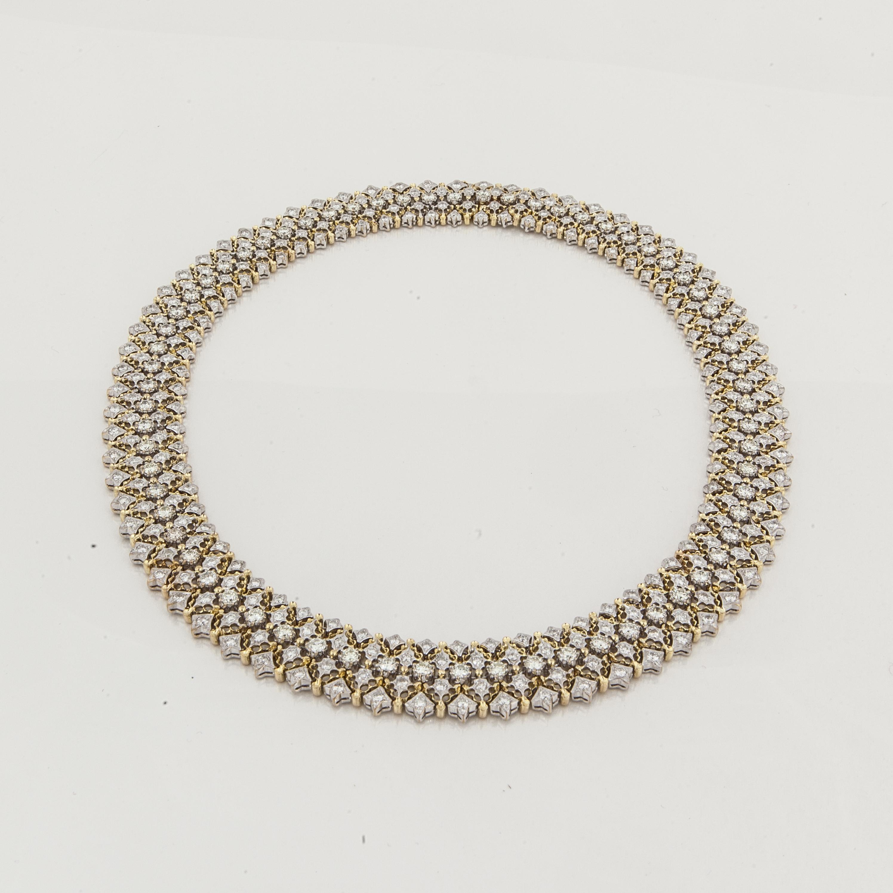 This collar necklace is 18K yellow and white gold and encrusted with round diamonds.  There are 335 round diamonds totaling 16.25 carats; H-I color and VS-SI clarity.  The necklace measures 17.25 inches long and is 11/16 inches wide.  