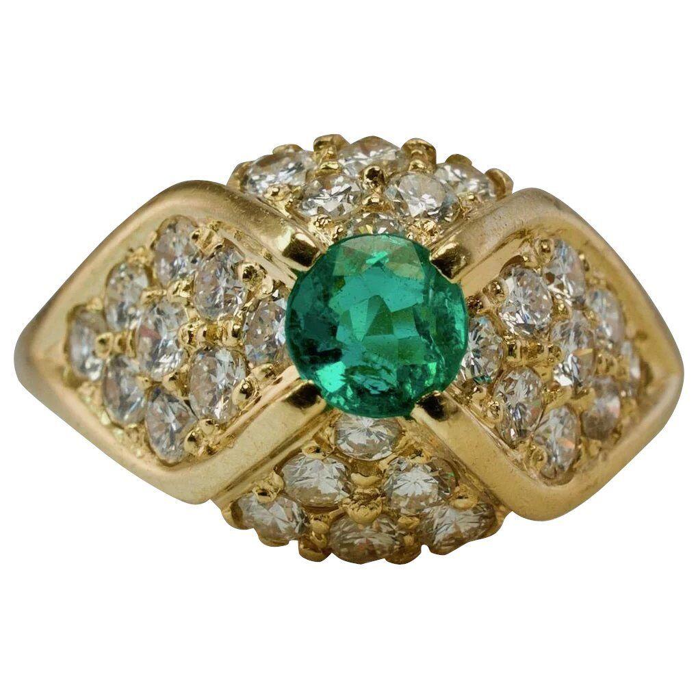 Natural Diamond Colombian Emerald Ring 14K Gold

This stunning estate ring is finely crafted in solid 14K Yellow gold and set with genuine Earth mined Emerald and diamonds. The 4mm round Colombian emerald is so clean and transparent, with great