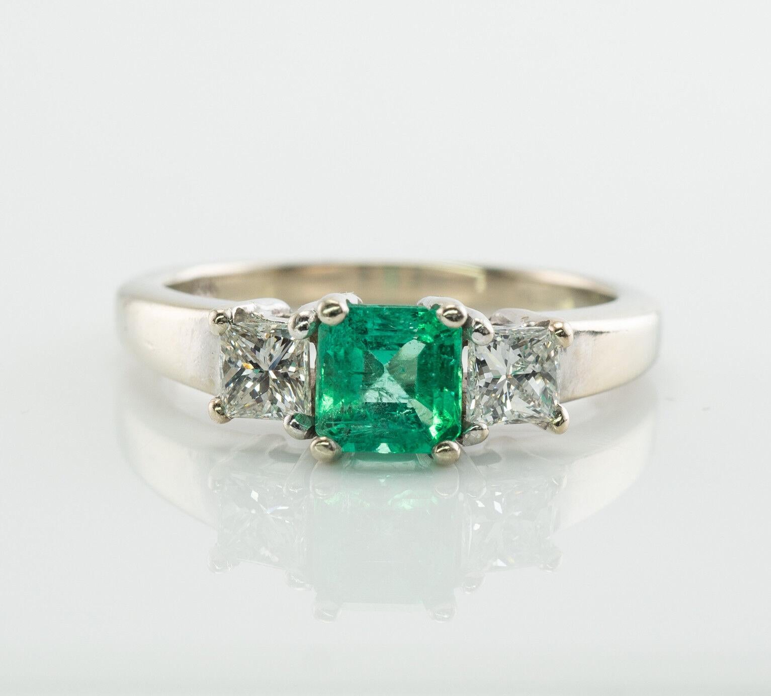 This gorgeous estate ring is finely crafted in solid 14K White Gold and set with genuine Earth mined High Quality Emerald and Diamonds.
The center square cut Colombian Emerald measures 6mm x 5mm (.73 carat) and this is a very clean and transparent
