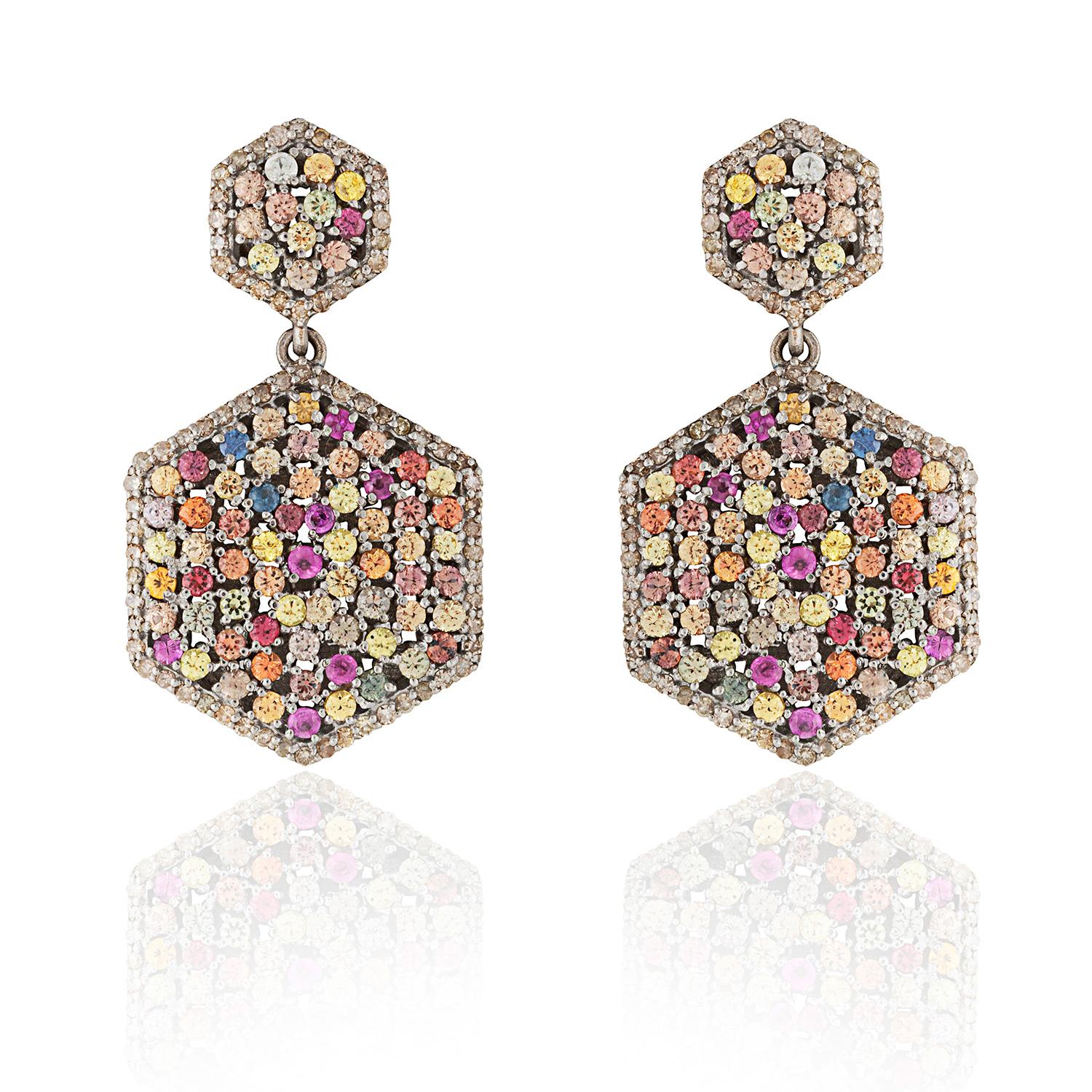 Consciously sourced multi coloured sapphires & single cut diamonds in a art deco hexagonal earring drop.  Consciously hand crafted for pierced ears.

Single cut diamonds; (1.23 carat); Multi Coloured Sapphire (5.11 carat) set on silver.

3 cm in