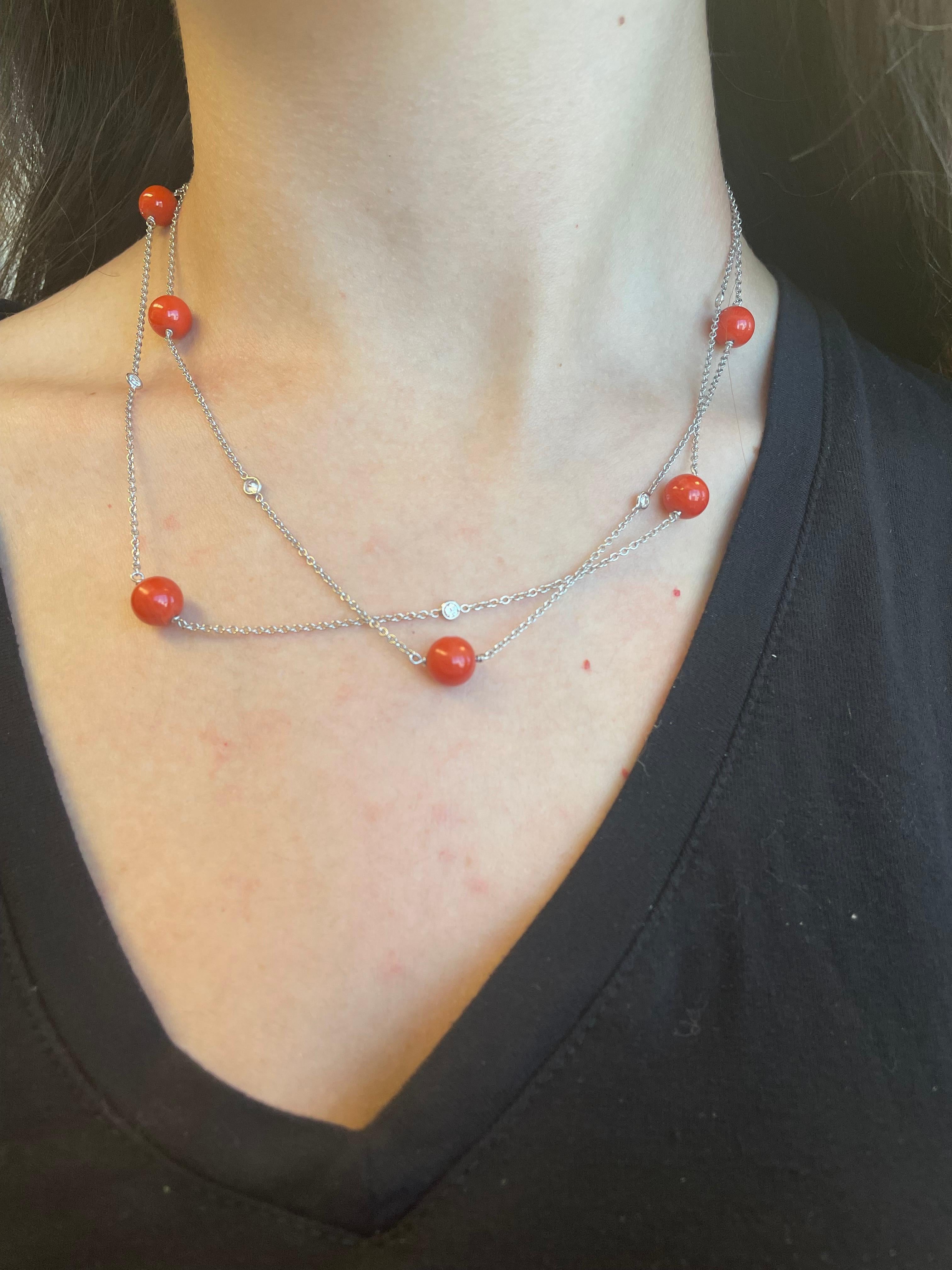 Pretty diamond by the yard and coral necklace, can be doubled. 
6 round brilliant diamonds, 0.71 carats. Approximately G/H color and SI clarity. 6 beaded coal, 18k white gold.
Accommodated with an up-to-date digital appraisal by a GIA G.G. once