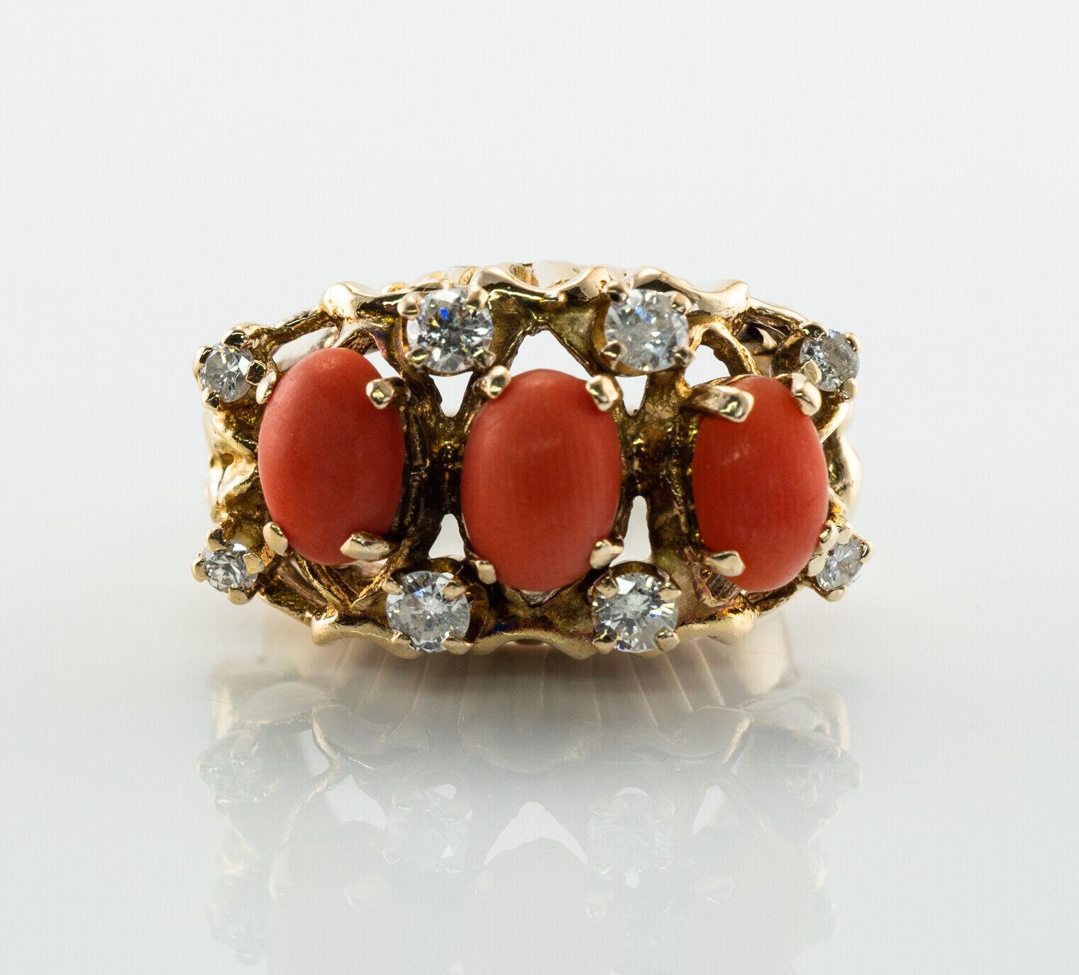 This vintage ring is finely crafted in solid 14K Yellow Gold and set with natural Corals and genuine diamonds.
Each coral cabochon measures 7mm x 5mm. These corals are a high quality with a beautiful color.
Eight round brilliant cut diamonds are SI2
