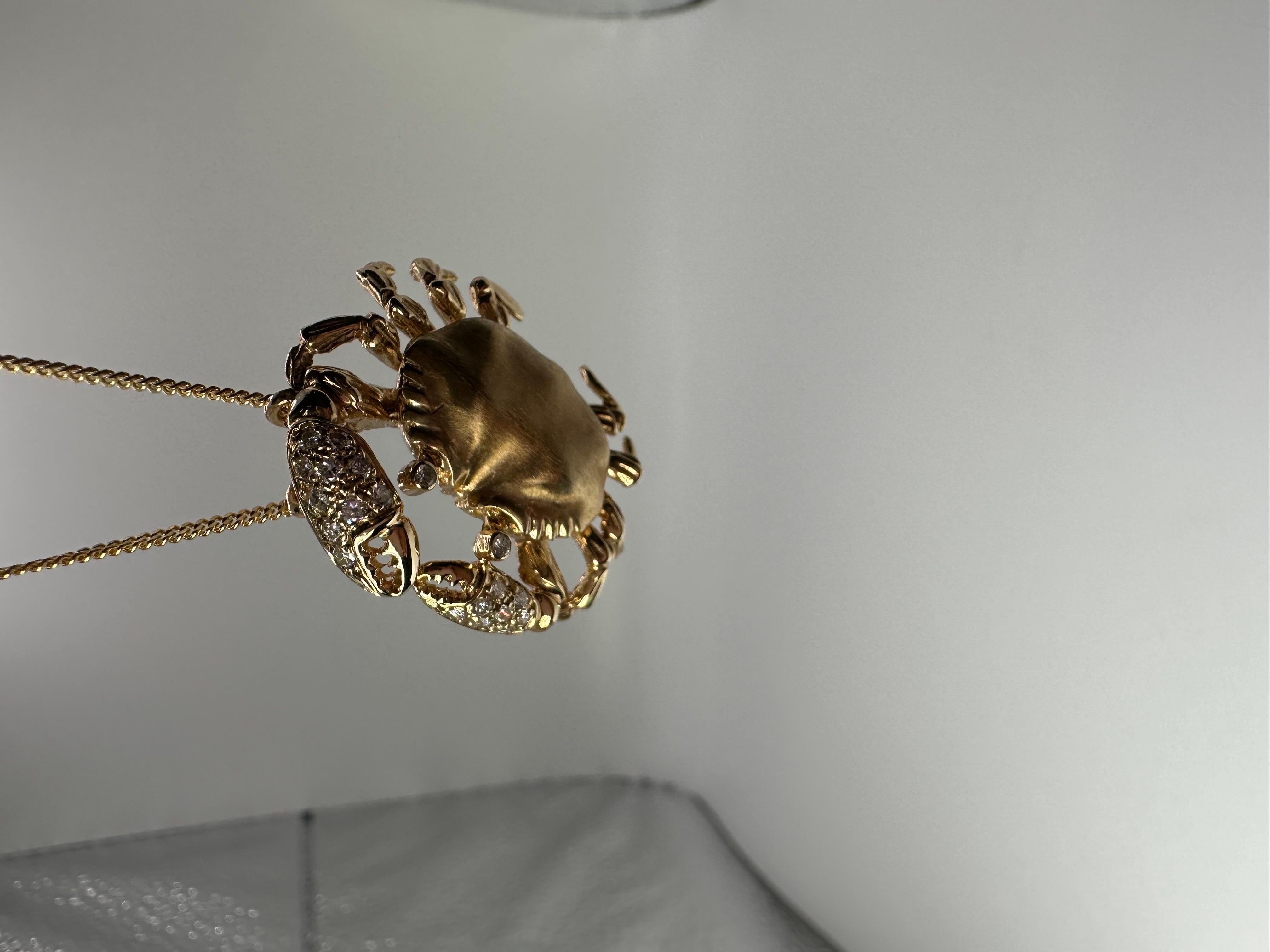 Unique custom crab made in 14KT matte gold with fine diamonds.

GOLD: 14KT gold
NATURAL DIAMOND(S)
Clarity/Color: SI/GH
Carat:0.20ct
Grams:7.25
Item#: 160-00014 APM

WHAT YOU GET AT STAMPAR JEWELERS:
Stampar Jewelers, located in the heart of