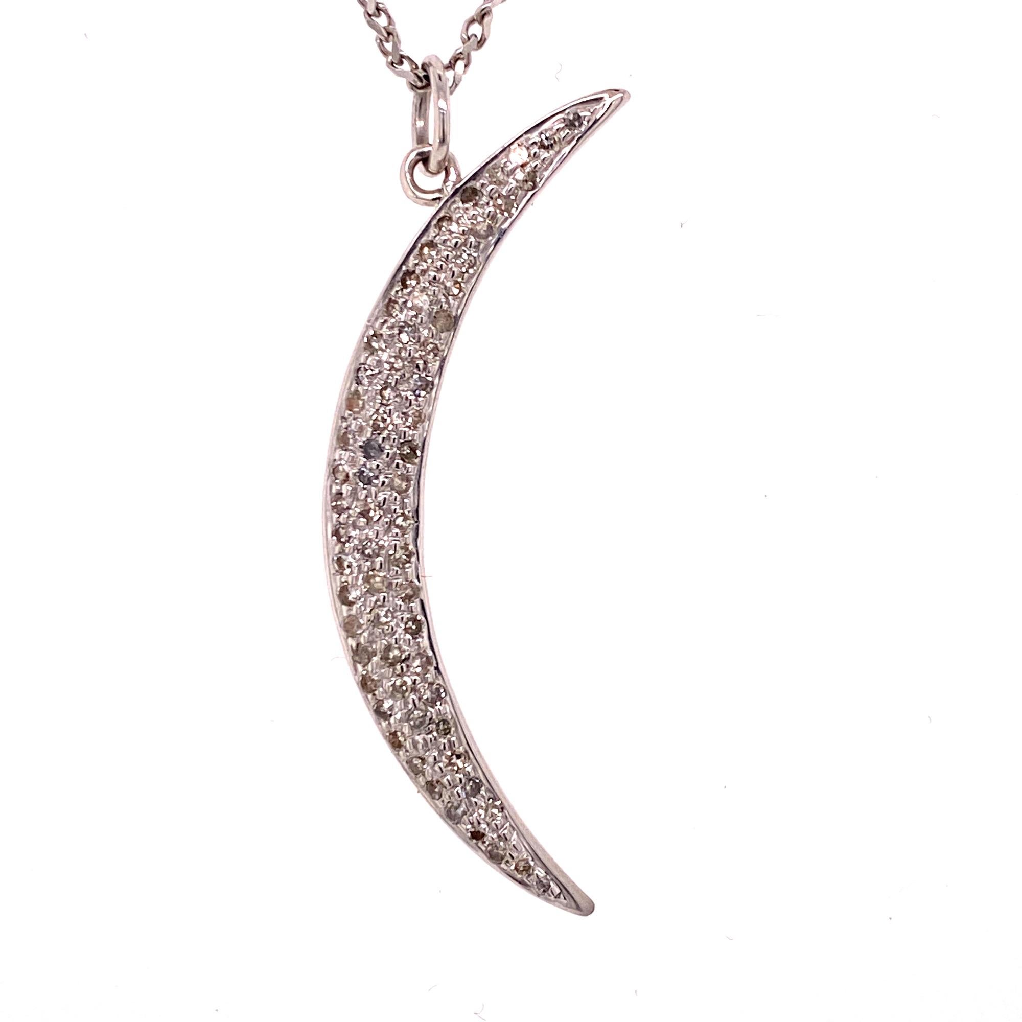 Stylish crescent moon pendant fashioned in 18 karat white gold. The diamond pendant features round briliant cut diamonds weighing .50 ctw. The pendant measures 1.5 x .20 inches and the chain measures 16 inches in length. 