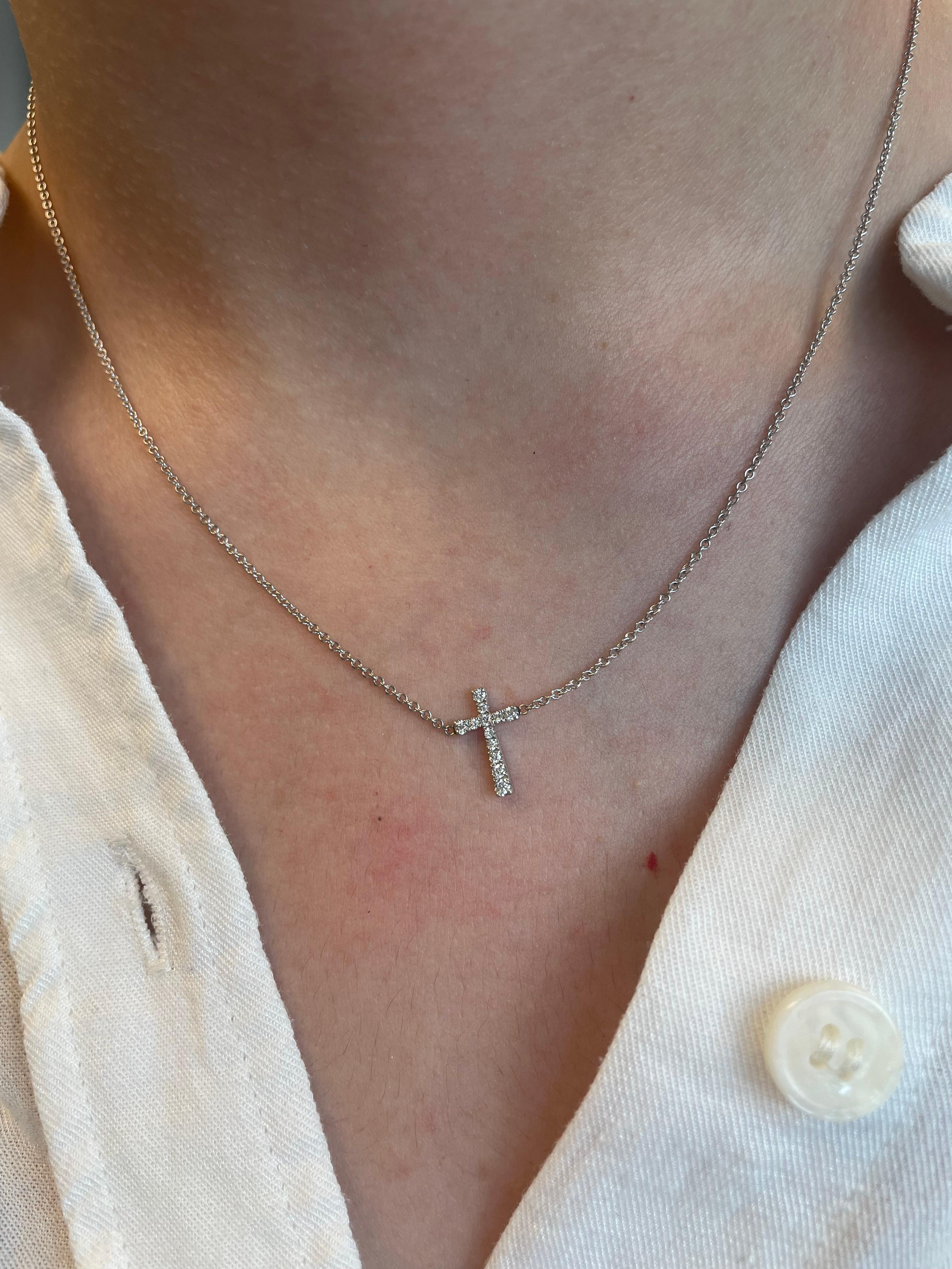Beautiful diamond cross pendant necklace, made in Italy.
12 round brilliant diamonds, approximately 0.20 carats. Approximately H/I color and VS clarity. 18k white gold. 
Accommodated with an up-to-date appraisal by a GIA G.G. once purchased, upon