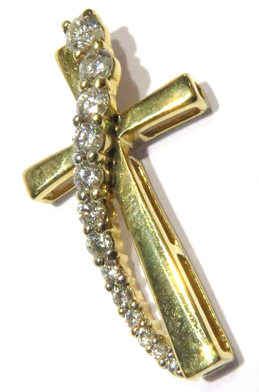 This elegant 14k yellow gold diamond cross is a perfect gift for any occasion. There are 13 prong set diamonds containing approx .30ct diamonds.
This cross measures 7/8 inch high by 1/2 inch across
This cross weighs 1.3 grams