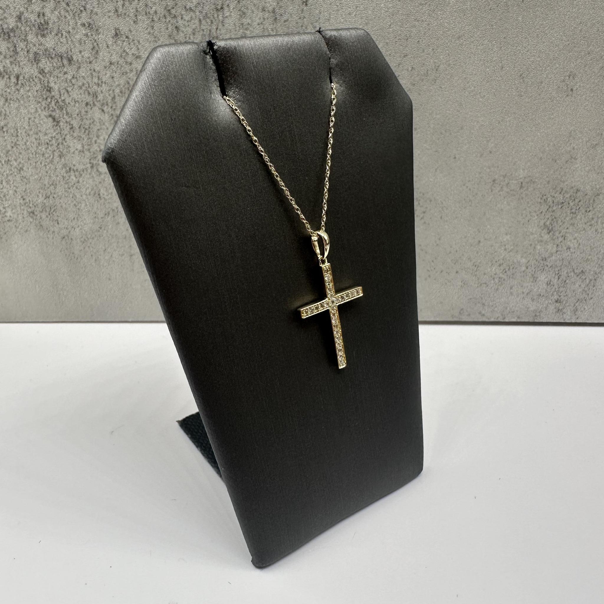 This stunning Diamond Cross Necklace in 14kt yellow gold features 0.17ctw of natural HI I1 round diamonds, adding a touch of sparkle to the cross design. The 18-inch length is perfect for most necklines, and the spring ring clasp ensures a secure