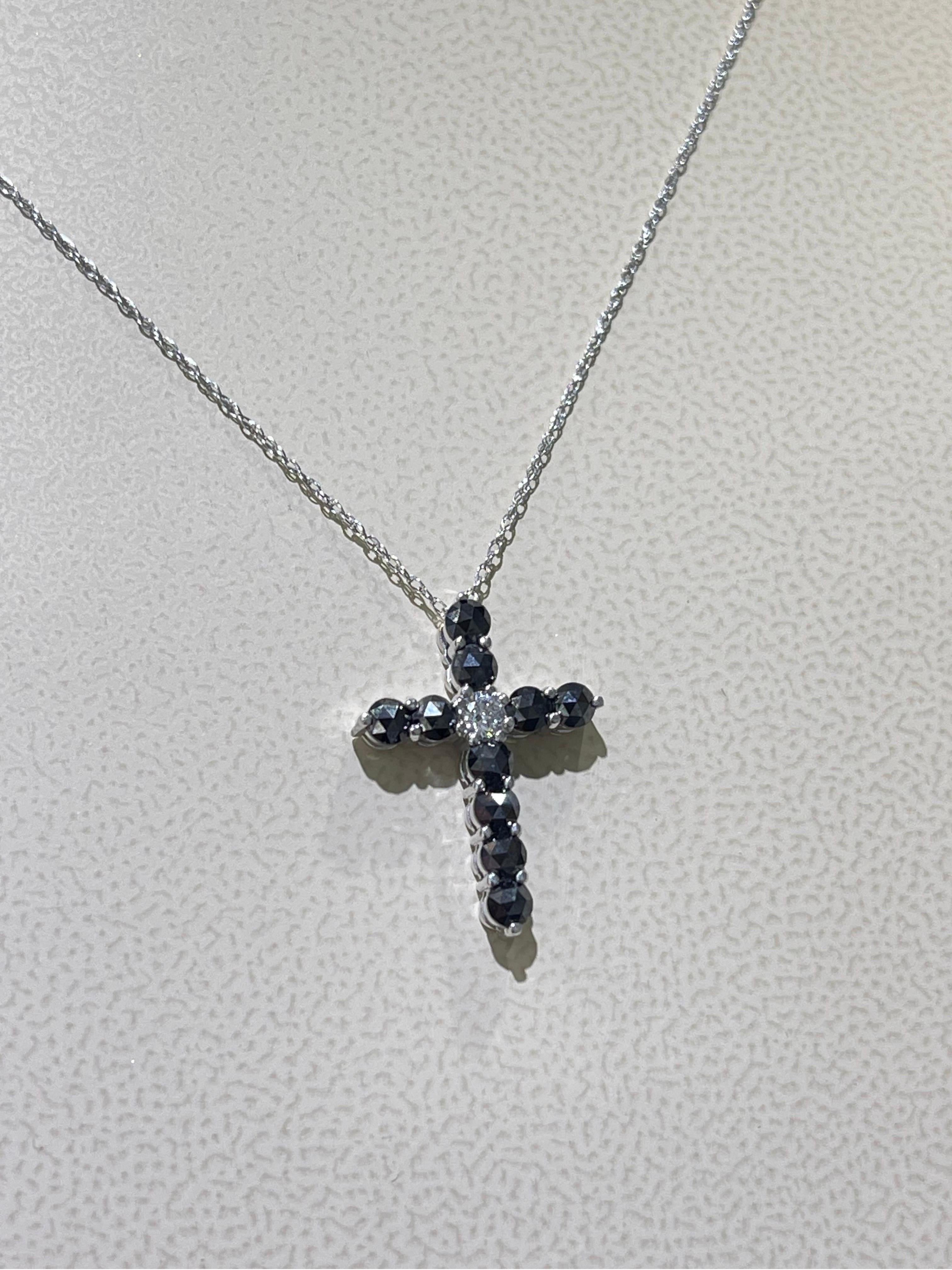 Diamond Cross Necklace In 18k White Gold,

- 1 carat total black & white diamonds weight,

- length of the necklace is 18”,

- cross dimensions 7/8” x 5/8”