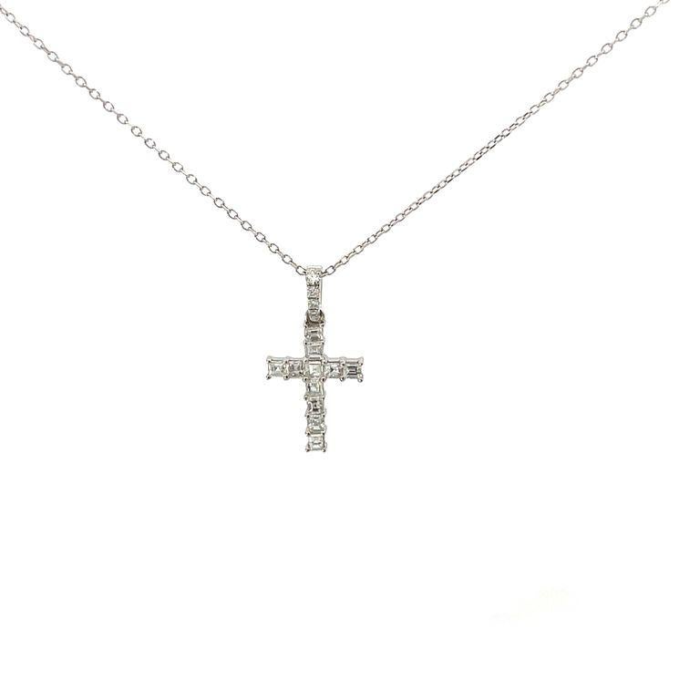 Looking for an everyday signature necklace that reflects your faith? Consider this cross pendant that features eleven Asscher-cut and four round white diamonds with a total weight of 0.37 carats. The diamonds are set in 18K white gold with a