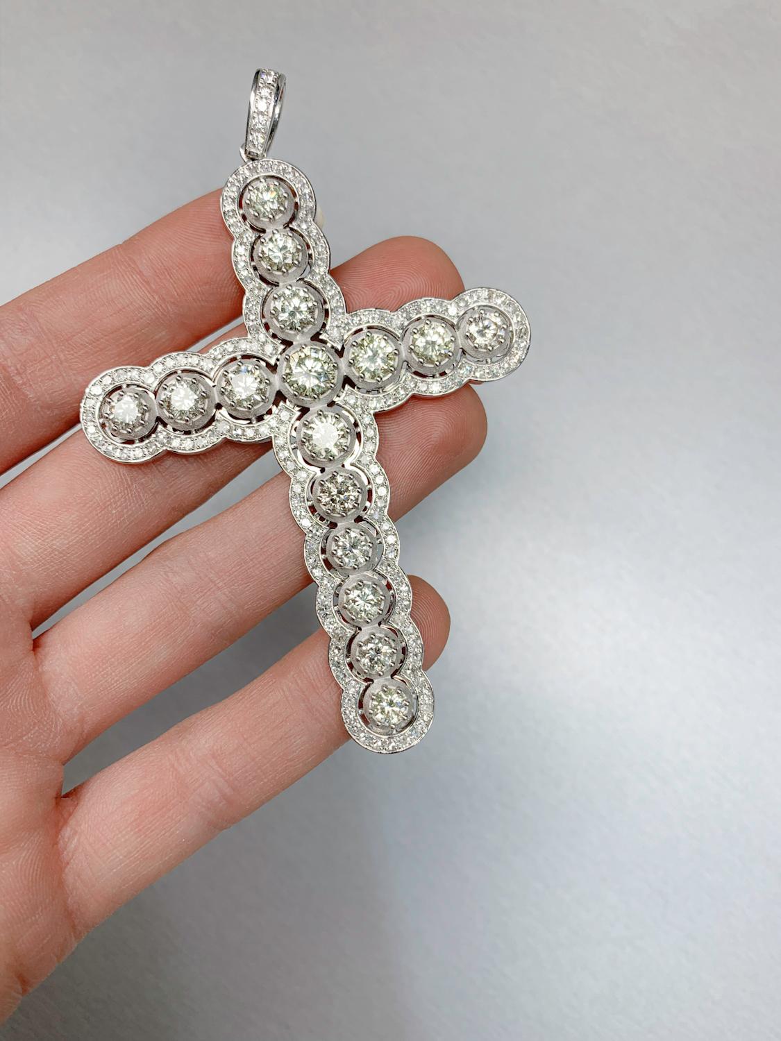 Introducing our breathtaking Diamond Cross Pendant, a symbol of faith and grace that beautifully combines the timeless brilliance of diamonds with the warmth of 18K gold. This pendant is designed to be a cherished and meaningful addition to your