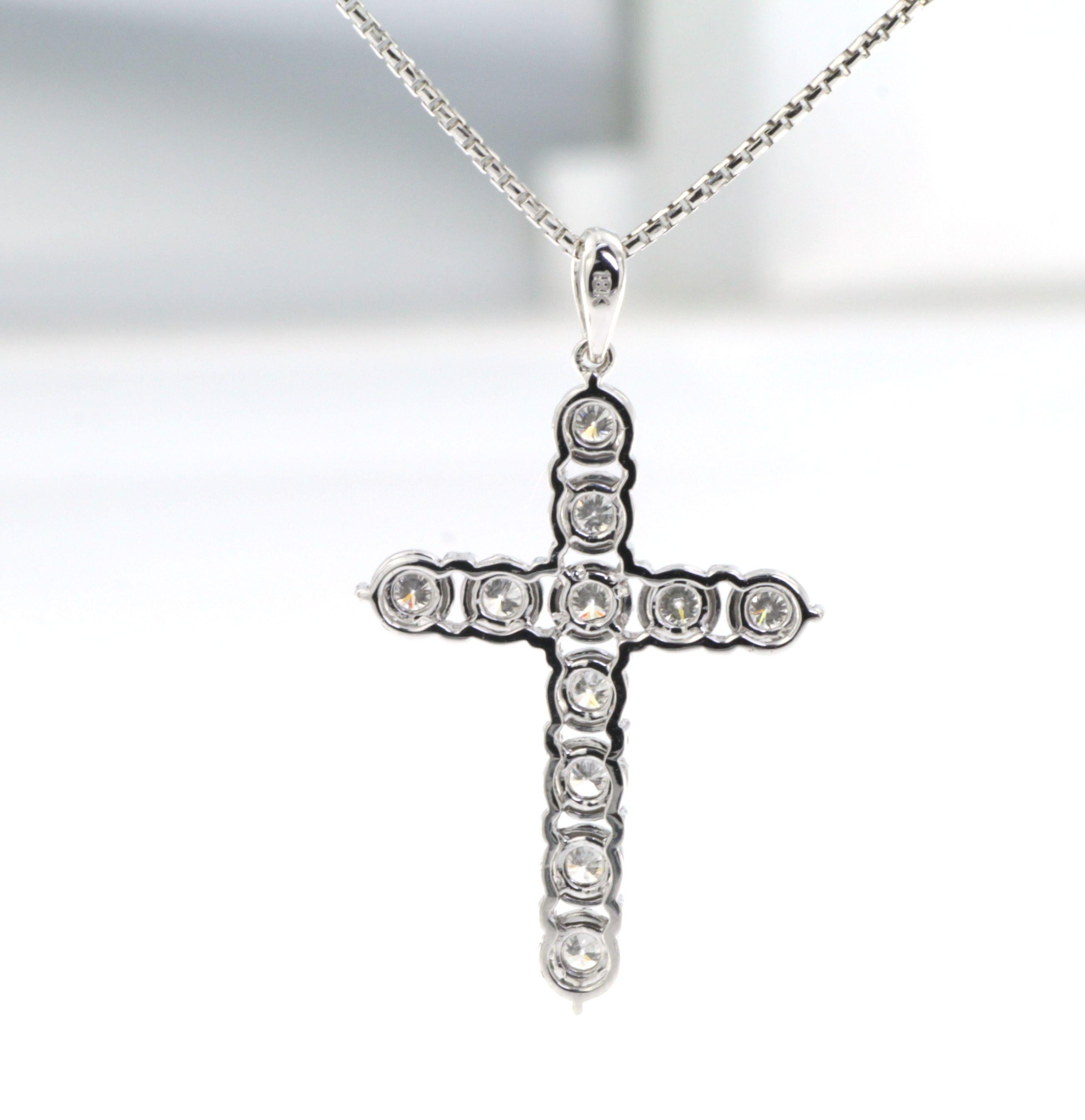  Introducing our exquisite 0.58Ct Diamond Cross Pendant in 18 Karat White Gold, a dazzling symbol of faith and elegance. Crafted with meticulous attention to detail, this pendant is a true masterpiece that captures the essence of timeless