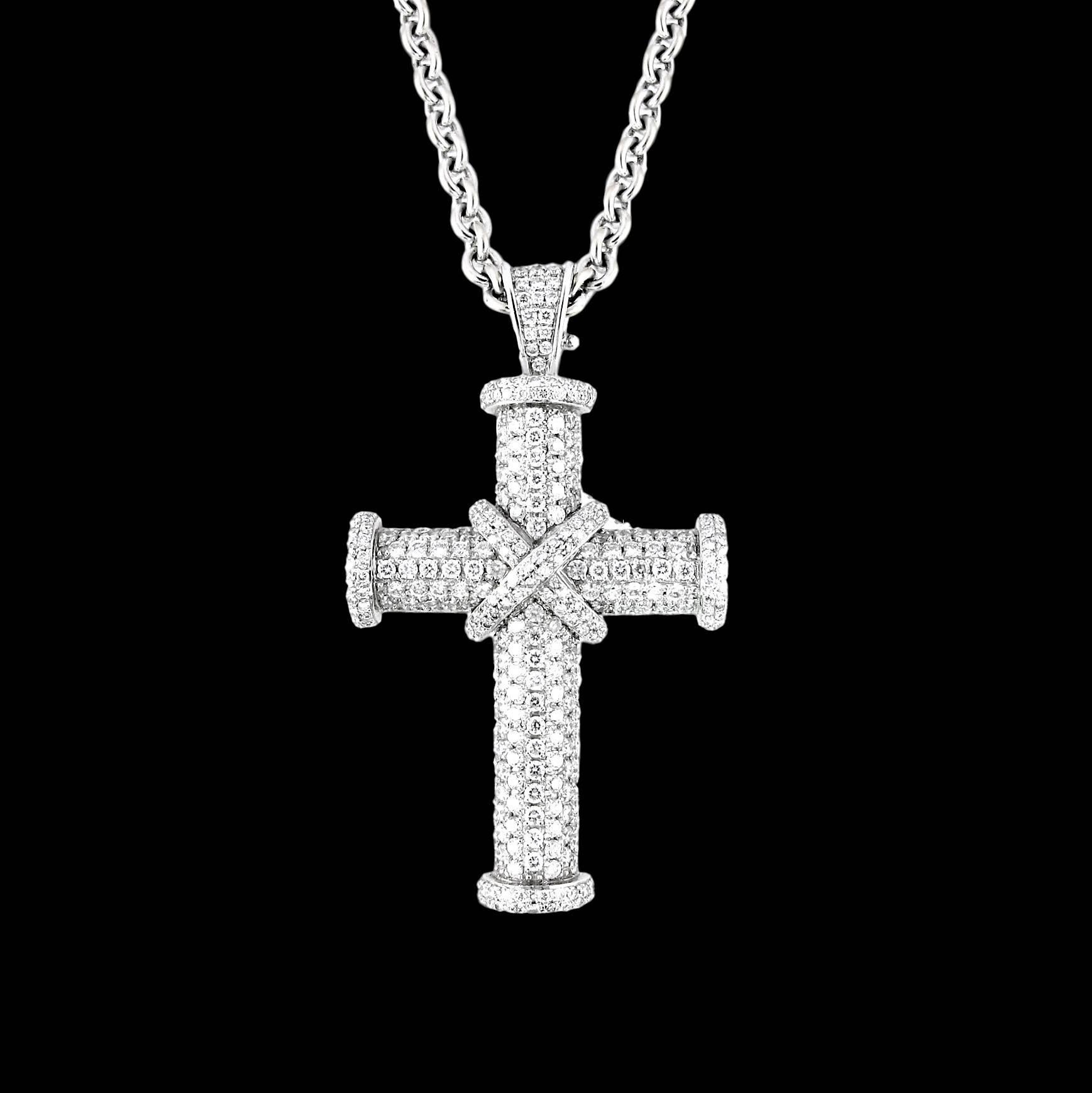 A simple cross pendant in 18ct white gold with full diamond pavé.
Theo Fennel:  