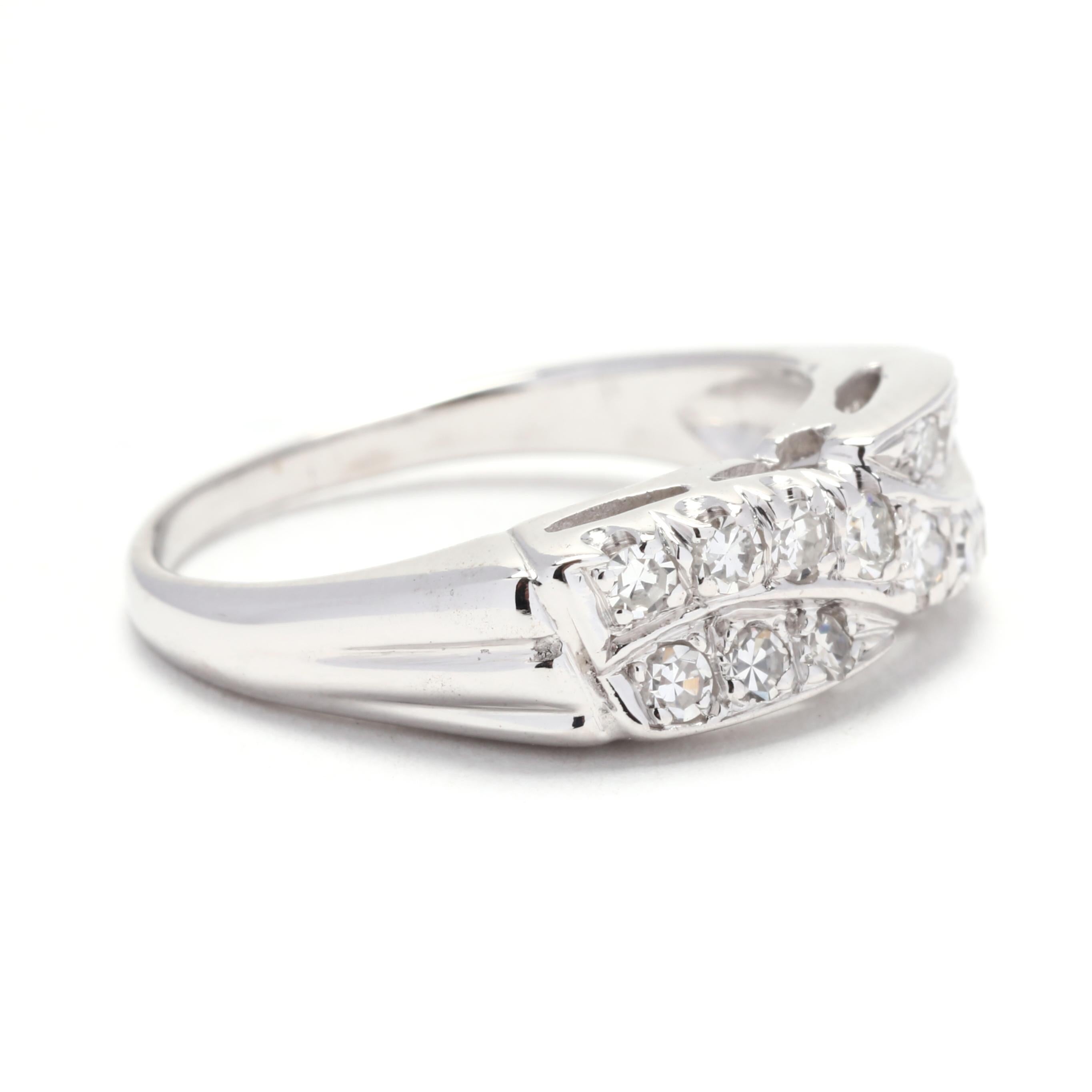 This vintage-inspired diamond crossover band ring is a beautiful and unique choice for your wedding band. Crafted in 14K white gold, this ring features a delicate crossover design adorned with sparkling round diamonds. The total carat weight of this
