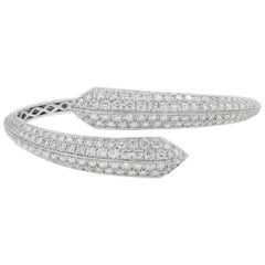 Diamond crossover semi eternity bangle with diamonds