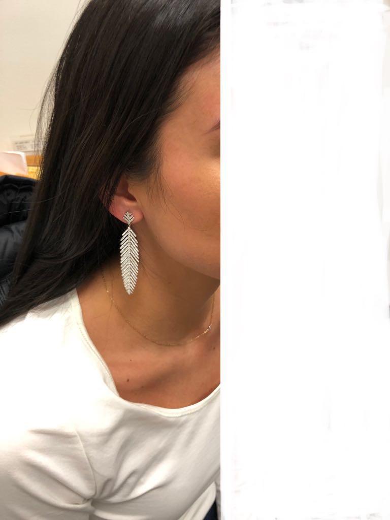 These beautifully crafted diamond crusted feather earrings have a total carat weight of 3.60, and are set in 18K white gold.


all items sold are accompanied by an appraisal done by our in-house gemologist, as well as original GIA certificates ,if