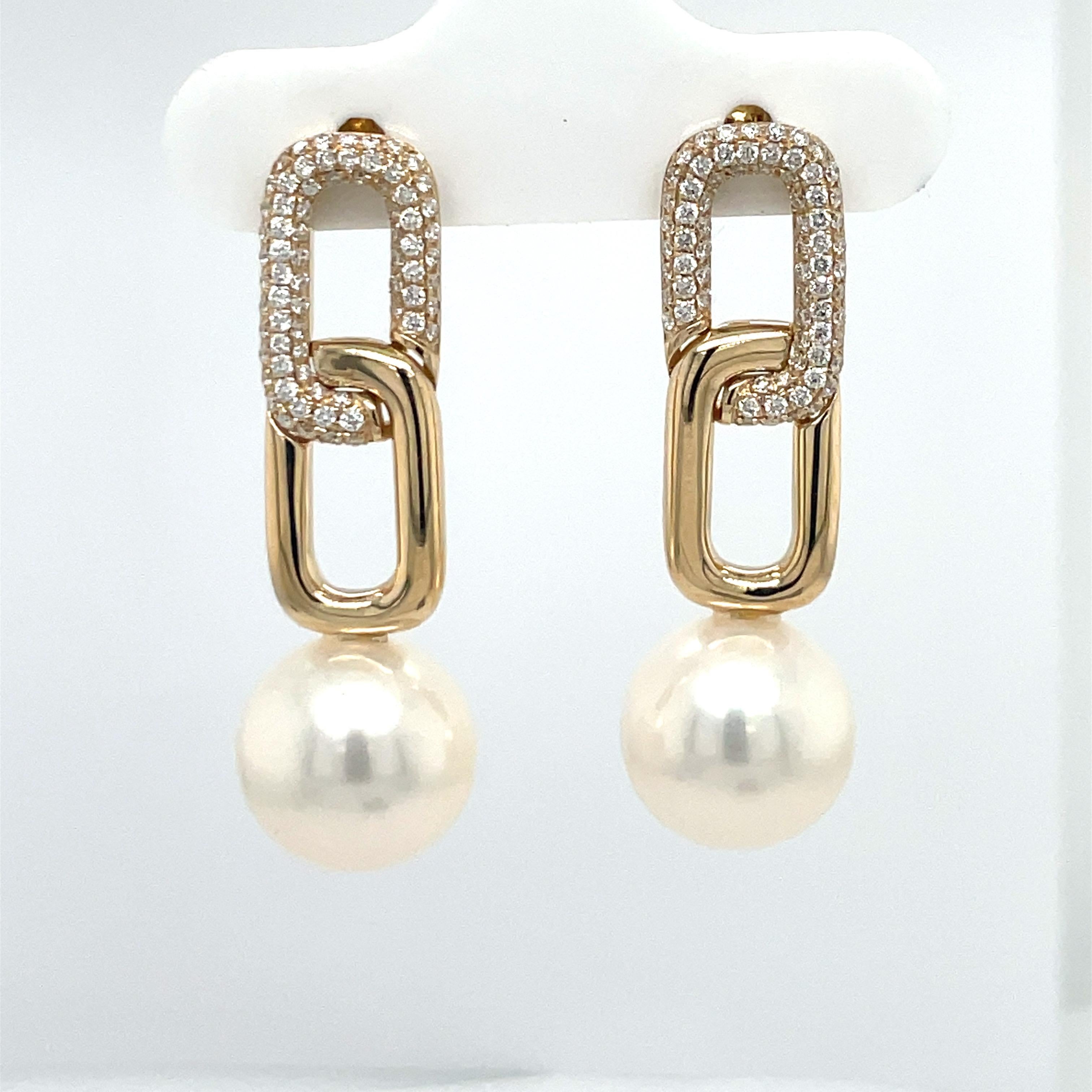 14 Karat Yellow gold Cuban link drop earrings featuring 142 round brilliants weighing 0.46 Carats and two Freshwater Pearls measuring 11-122 MM. 
Can customize pearl color. 
