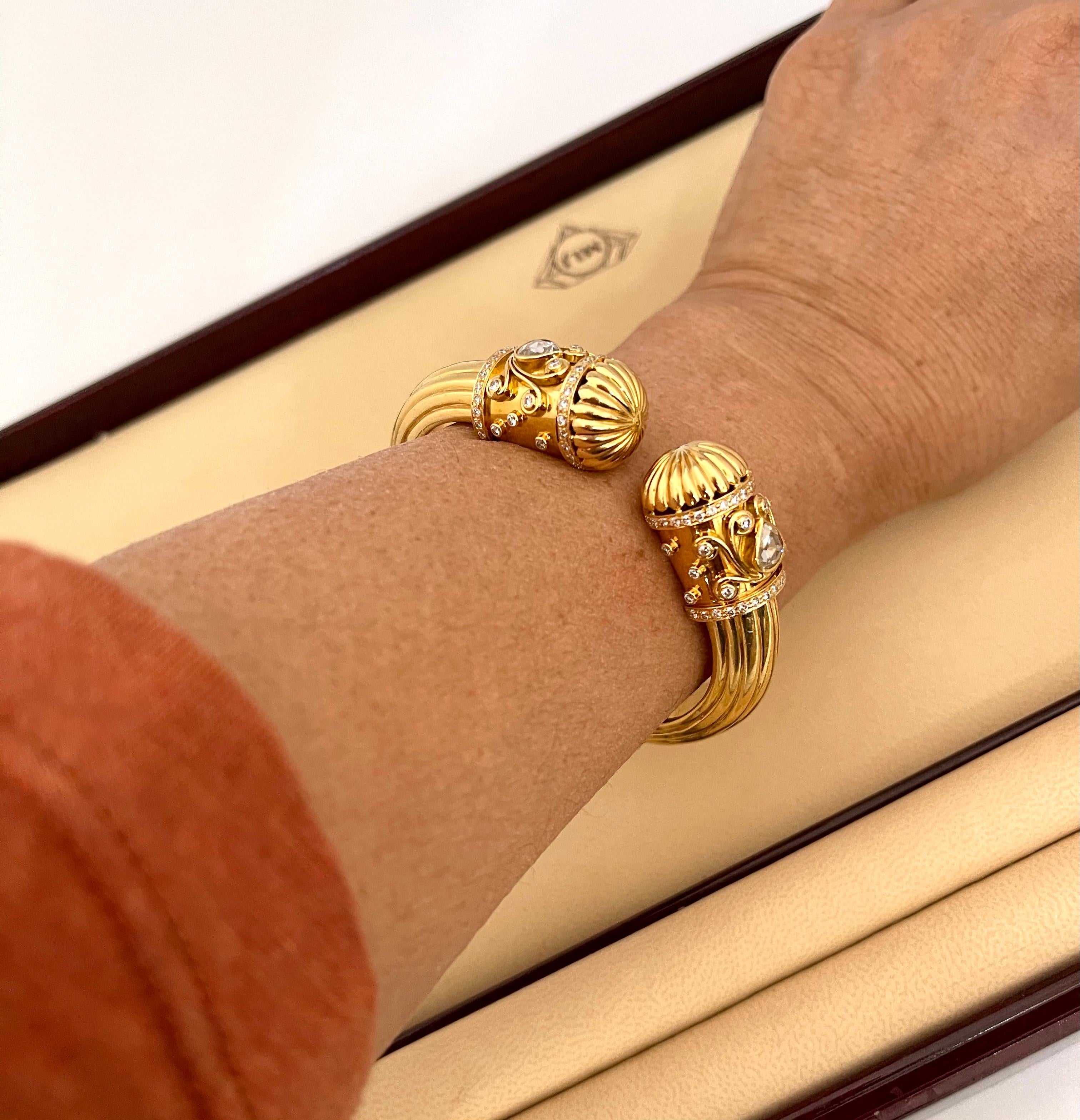 Diamond Cuff  Bangle Bracelet 18 Karat Yellow Gold 59 Gram
It features a bangle crafted from an 18  karat  Yellow gold and embedded with  Diamonds on the ends of the bangle. .
Open from one side for easy access to wear it. 
Round brilliant cut