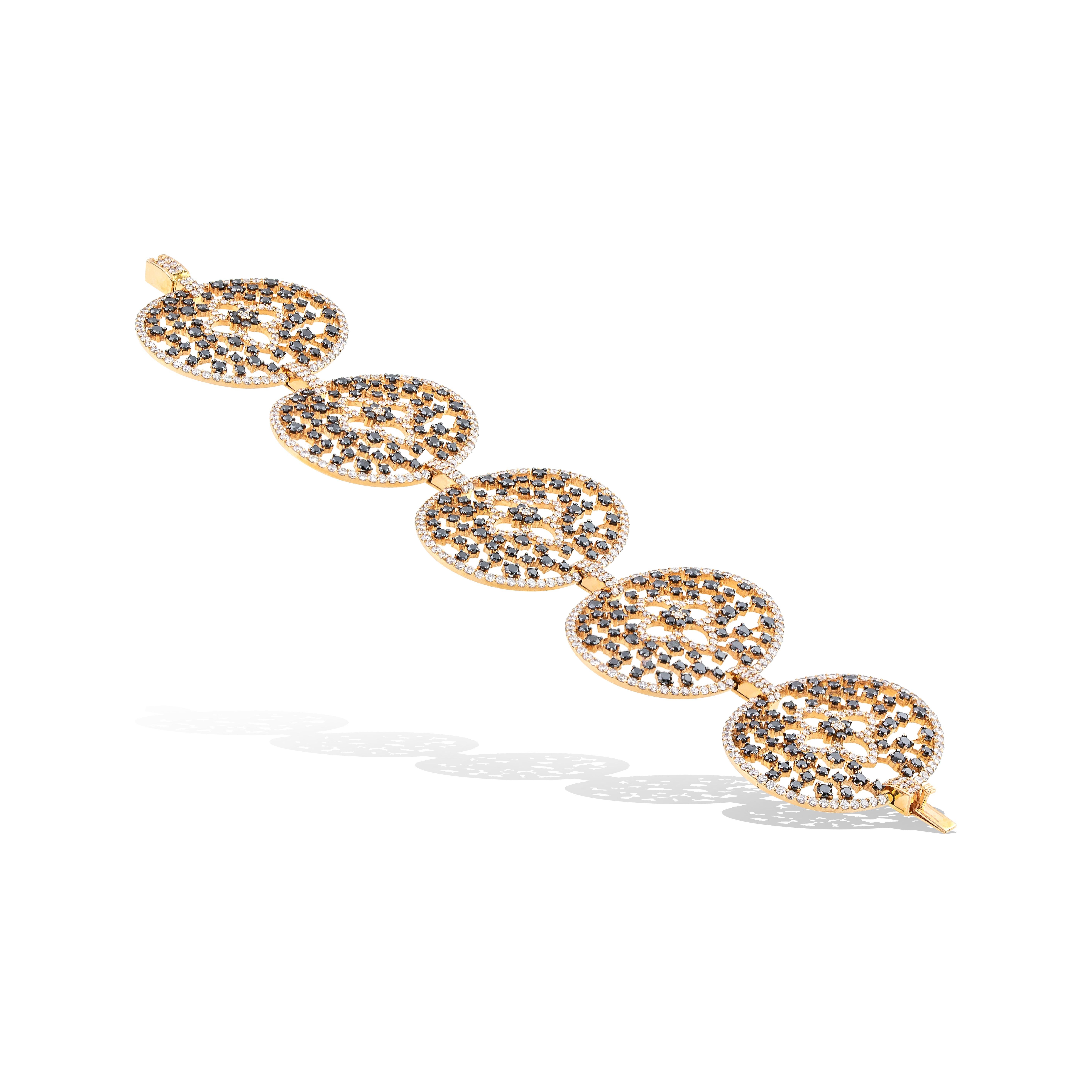 Unique Statement Cuff Flower Bracelet with 830 in total black and white brilliant cut diamonds handcrafted in 18Kt yellow gold. 
Five oval pieces with white diamonds around them and black diamonds inside them create the elegant shilouete of this