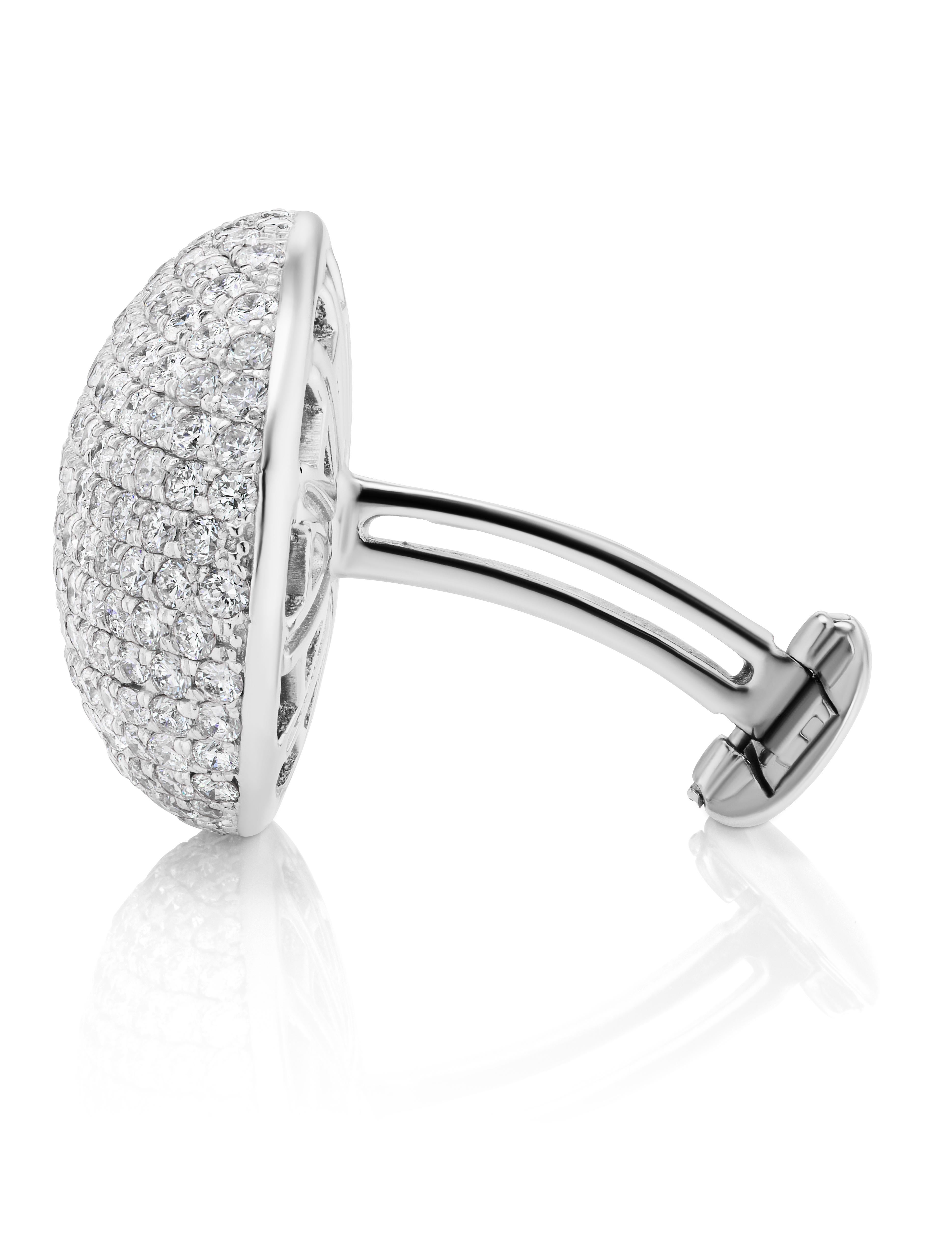 Oval Cufflink with lines of Diamonds set with 256 Round Diamonds weighing 3.67Carats.
Set in 18 Karat White Gold.