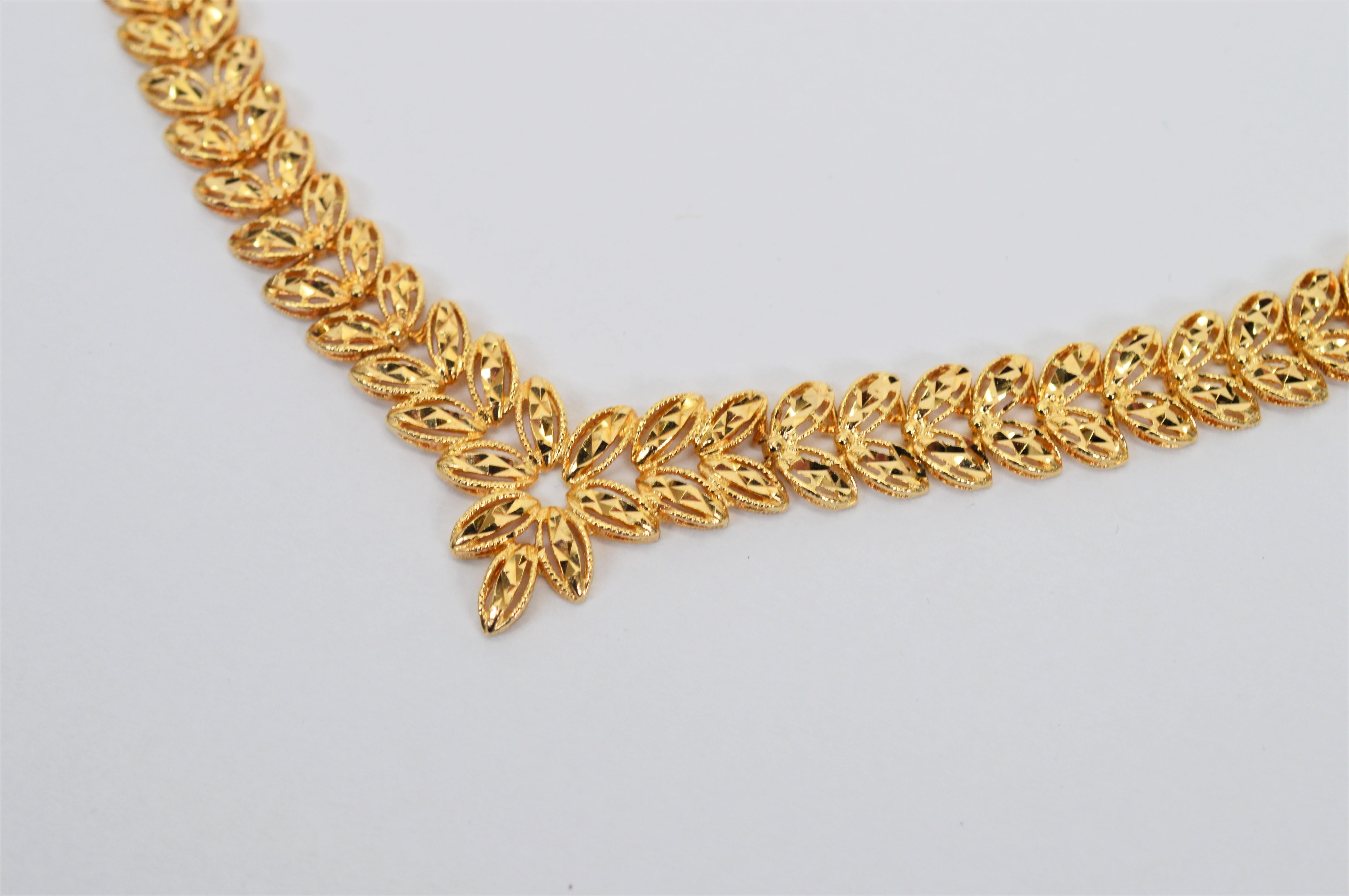 Diamond Cut 14 Karat Yellow Gold Chevron Leaf Portrait Necklace In Excellent Condition For Sale In Mount Kisco, NY