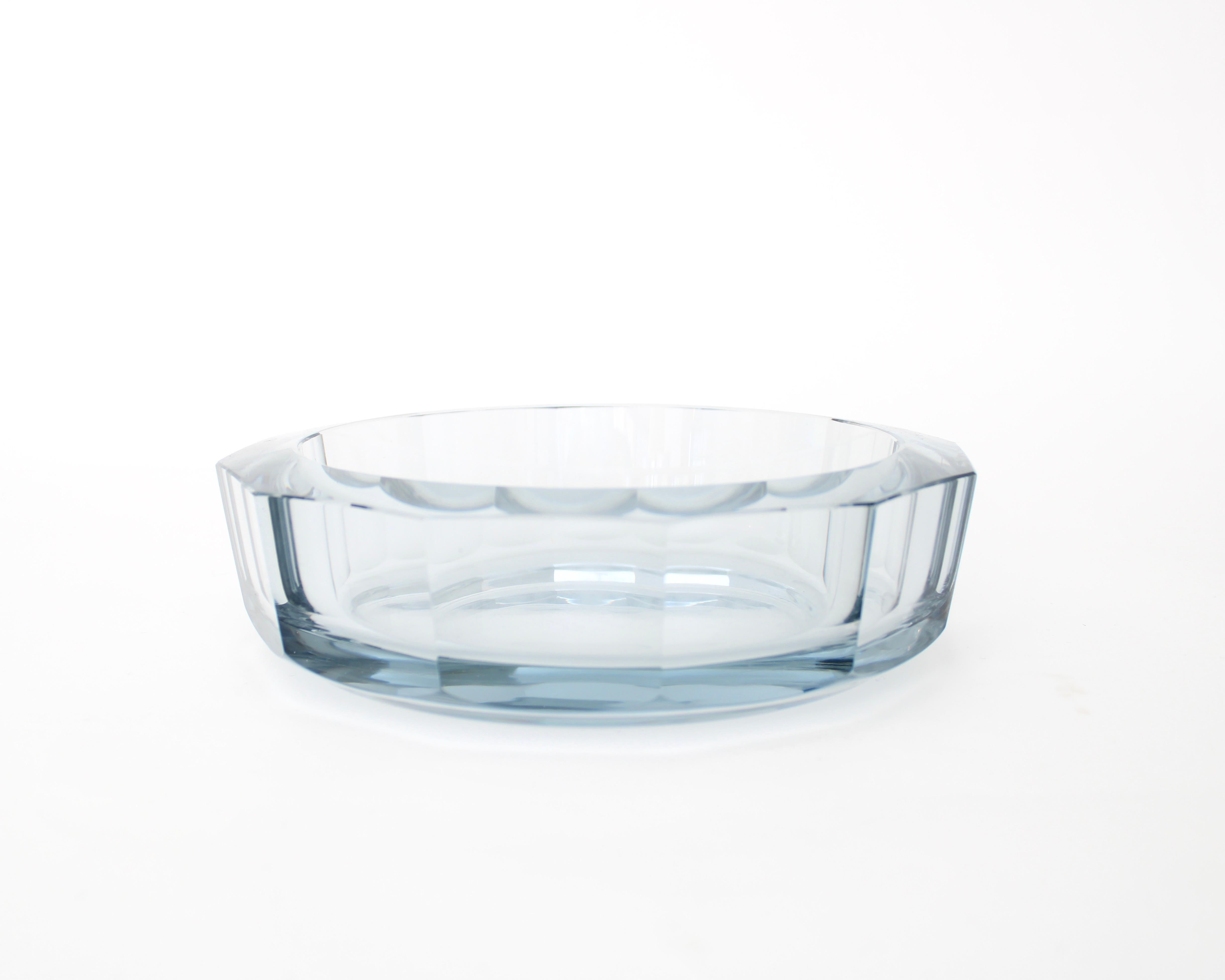 Diamond cut glass dish Designed by Asta Strömberg. Manufactured by Strömbergshyttan in Sweden during the 1950s. Engraved on bottom Stromberg and numbered.
Slightly colored with blue.
Excellent condition with no chips or flaws.