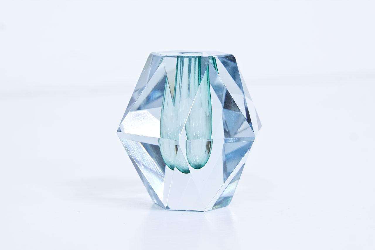 Diamond cut crystal glass vase. Green color glass cased in clear. Designed by Asta Strömberg, manufactured by Strömbergshyttan in Sweden during the 1950s. Engraved on bottom.