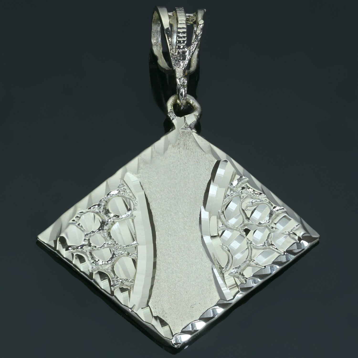 This modern brand new rhombus-shaped pendant features diamond-cut edges and texured accents crafted in 14k yellow gold. Made in United States circa 2000s. Measurements: 1.25