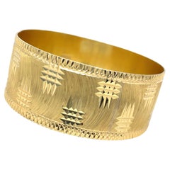 Bracelet large en or jaune 21k avec diamants