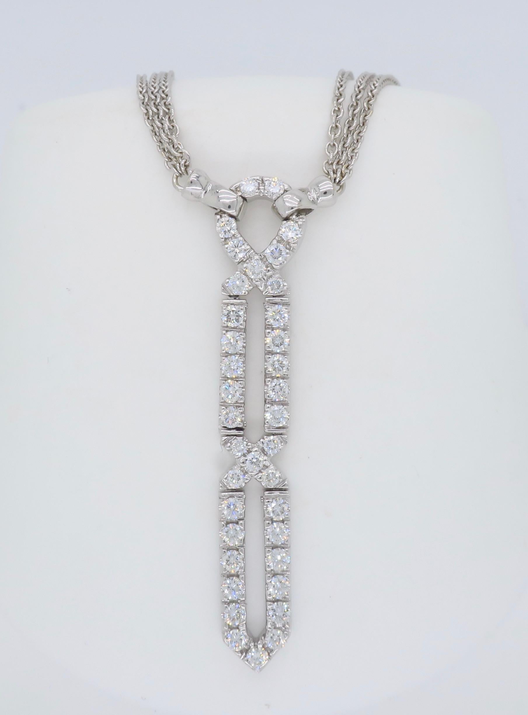 Triple stranded diamond drop pendant necklace crafted in 18k white gold.

Diamond Carat Weight: Approximately .99CTW
Diamond Cut: Round Brilliant Cut
Color: Average G-I
Clarity: Average VS
Metal: 18K White Gold
Pendant Length: Approximately 1.75”