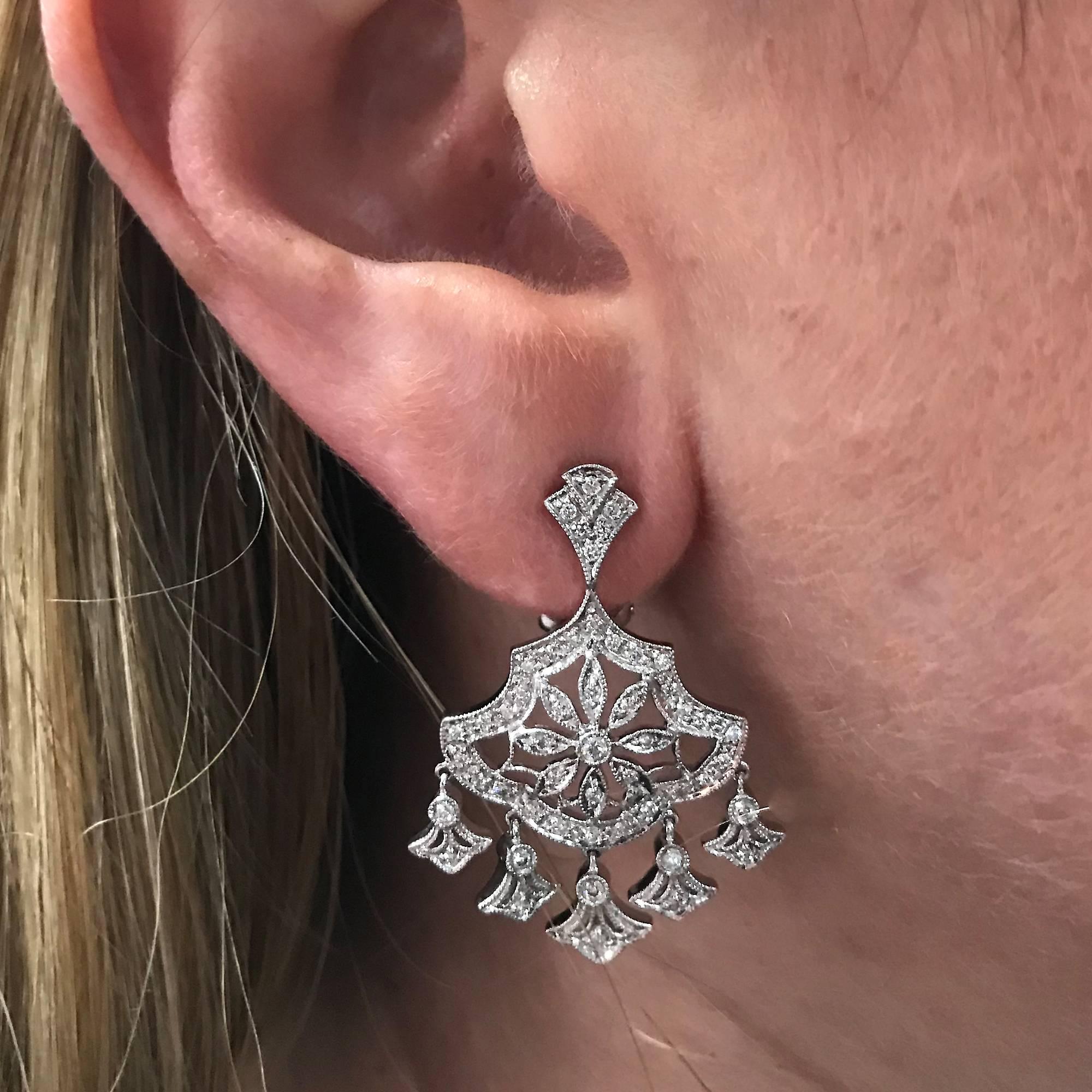 14k white gold earrings featuring 100 round brilliant cut diamonds weighing approximately 1ct total G color VS clarity.  

Our pieces are all accompanied by an appraisal performed by one of our in-house GIA Graduates. They are also accompanied by