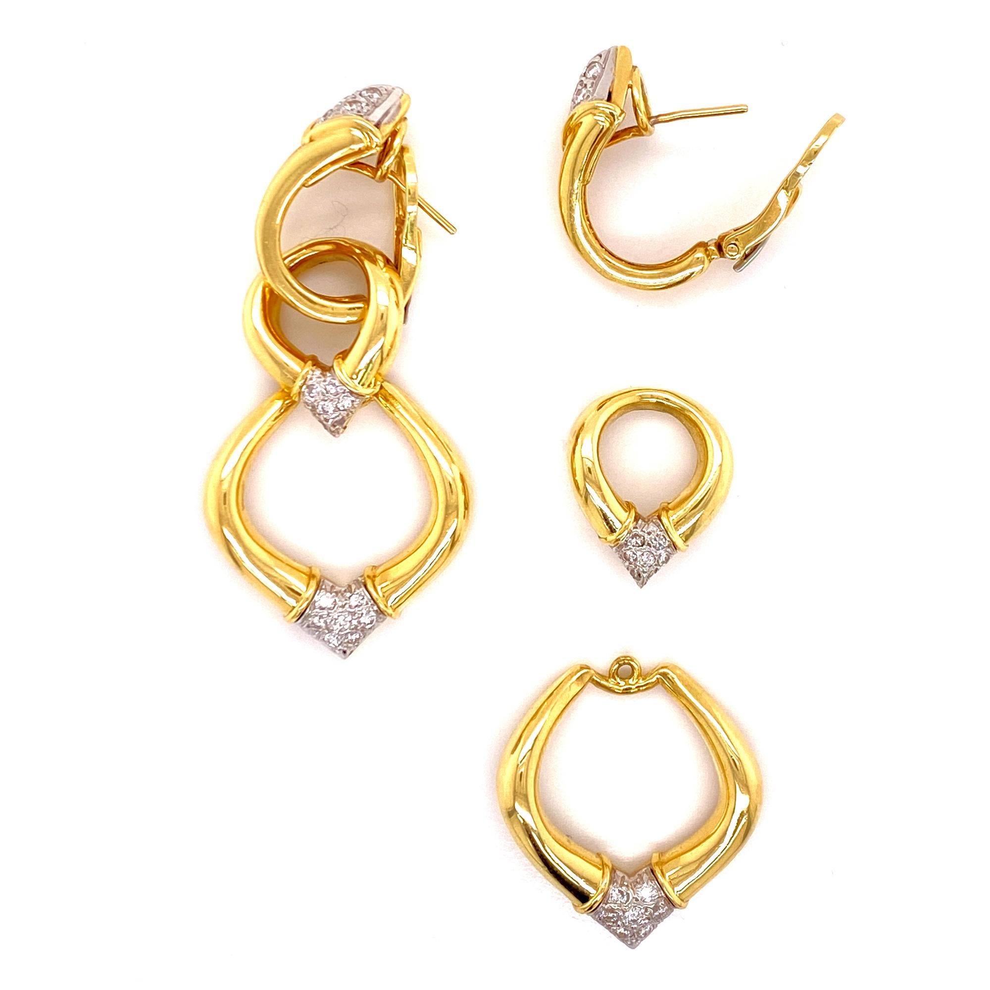 Stunning diamond dangle earrings fashioned in 18 karat yellow gold. The earrings feature round brilliant cut diamonds graded G-H color and VS clarity. The detachable links allow the earrings to be worn at 3 different lengths. The earrings measure 2