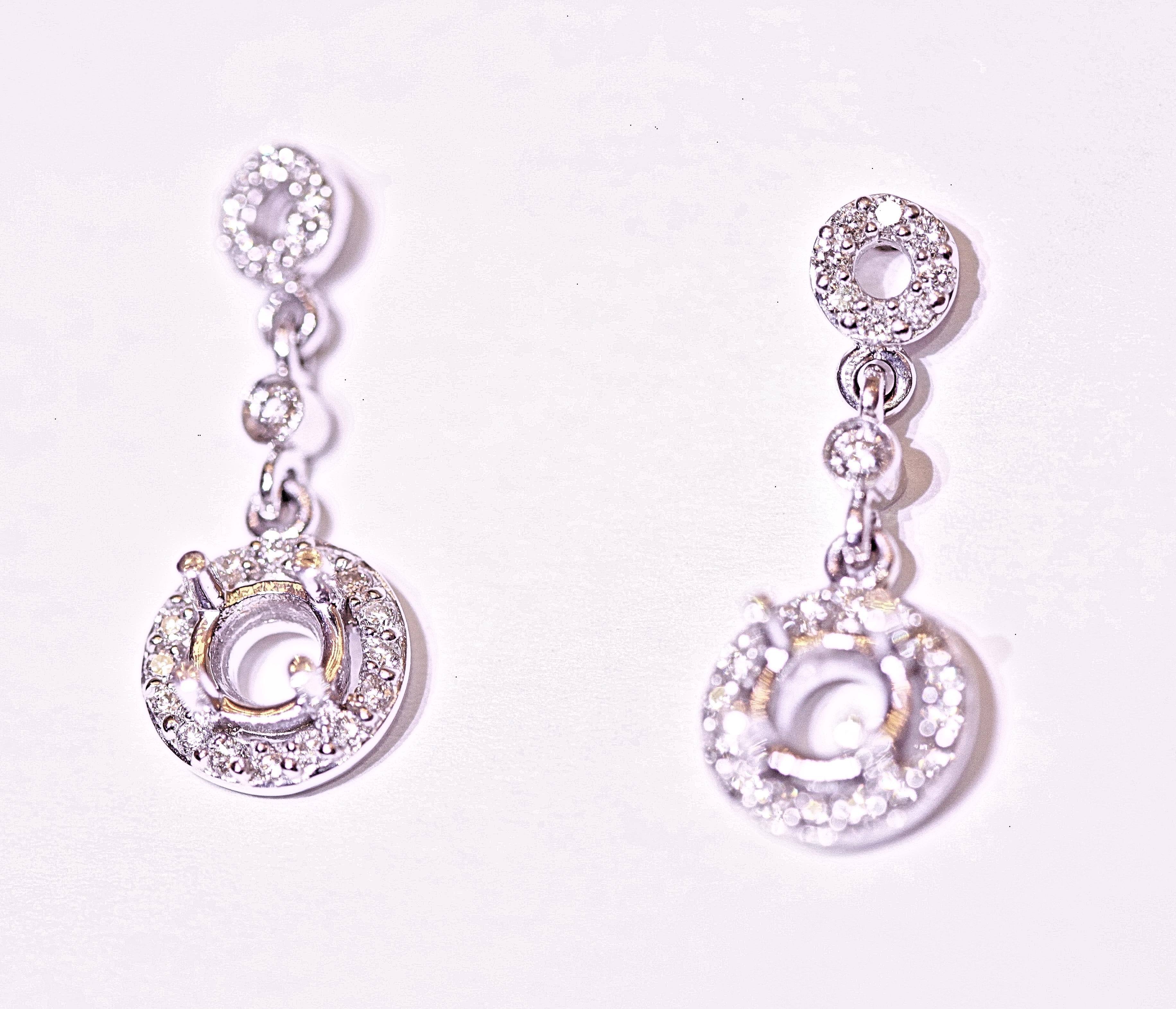 Beautiful diamond drop earrings with a 4 mm center that needs a diamond, sapphire, pearl or any color you want to use to enhance the earrings.  The diamonds are round brilliant cut with .24 carat total weight.  The earrings are 7/8 of an inch long