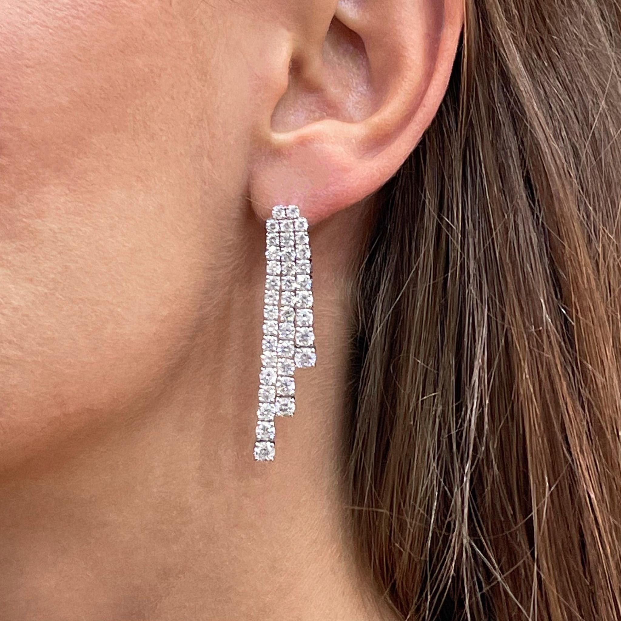 Beautiful Dangle Earrings Set With Round Diamonds. It comes with an appraisal by GIA G.G.
Total Carat Weight is 7.75 Carats
Diamonds Color is F-G
Diamonds Clarity is VVS-VS
Metal is 18K White Gold