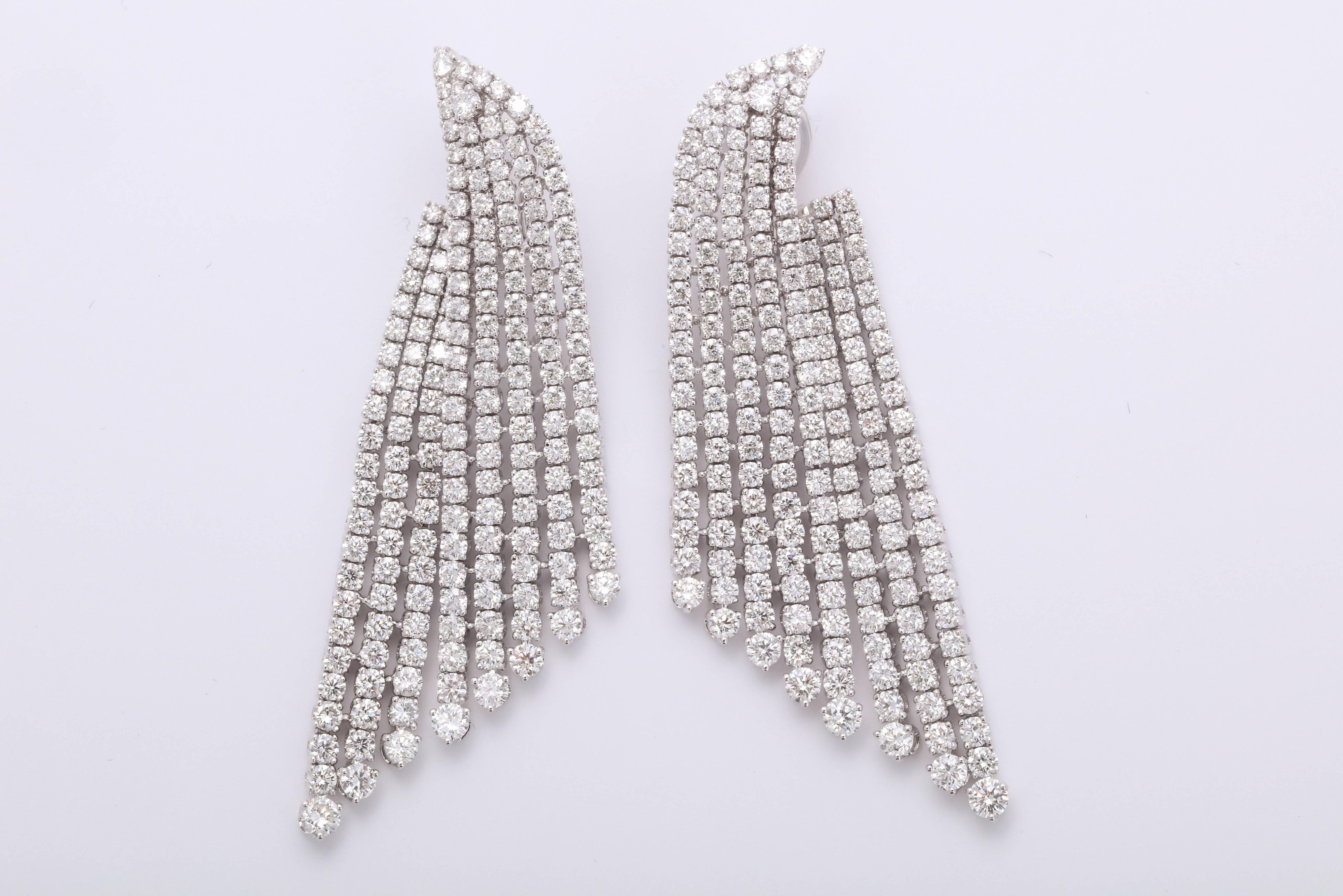 
A gorgeous and grand pair of diamond earrings. 

20.80 carats of white round brilliant cut diamonds set in 18k white gold 

Just under 3 inches long from the highest to lowest point, a little over an inch at its widest point. 

The diamonds are set